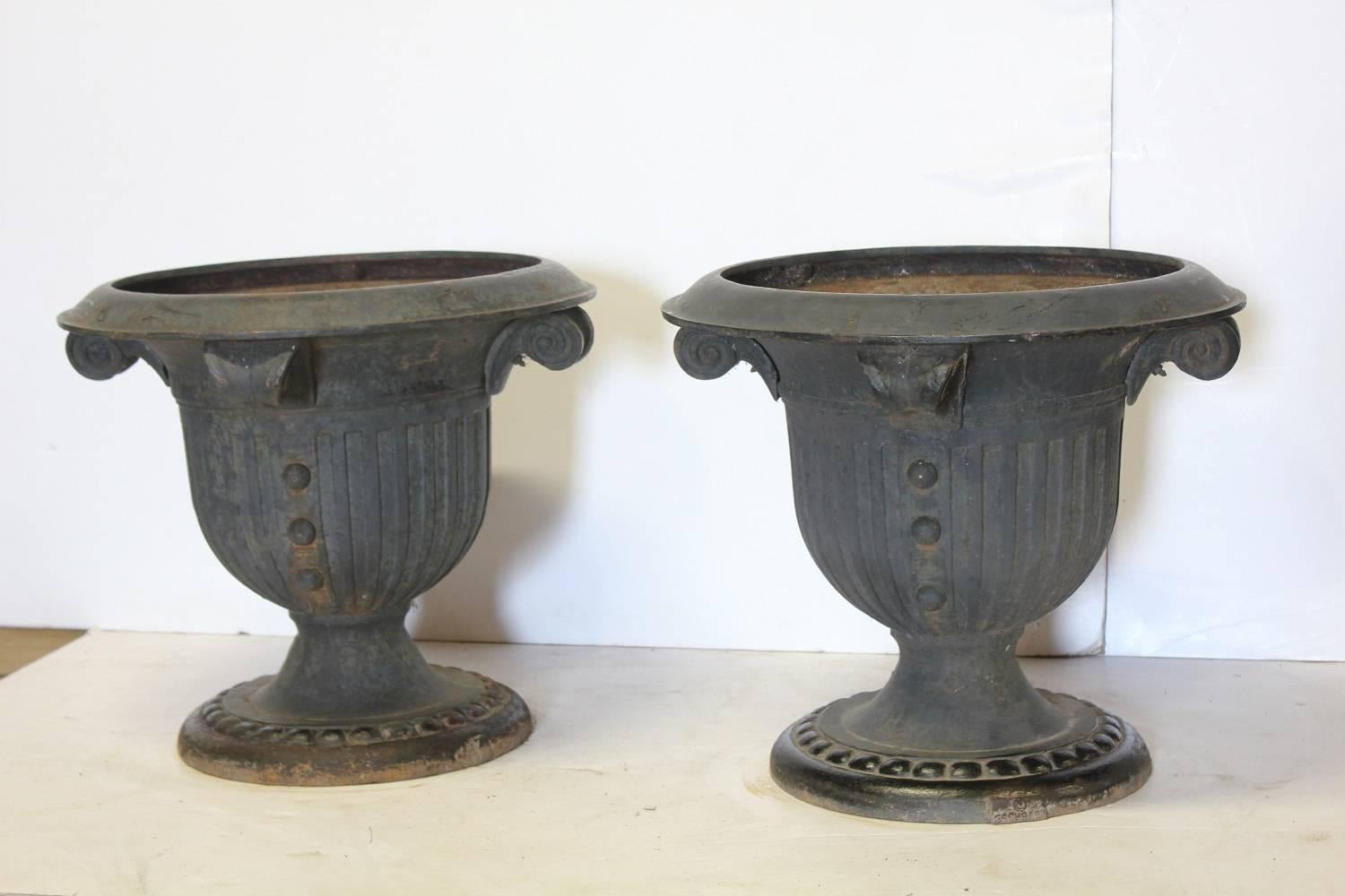 Spectacular pair of cast iron urns by Eschbach. They are signed.