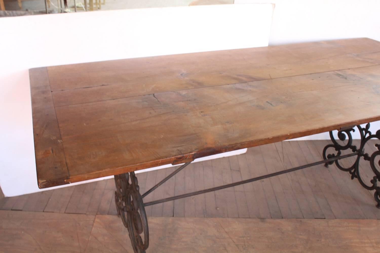 Rustic American Wrought Iron and Wood Base Dining Table, circa 1900s