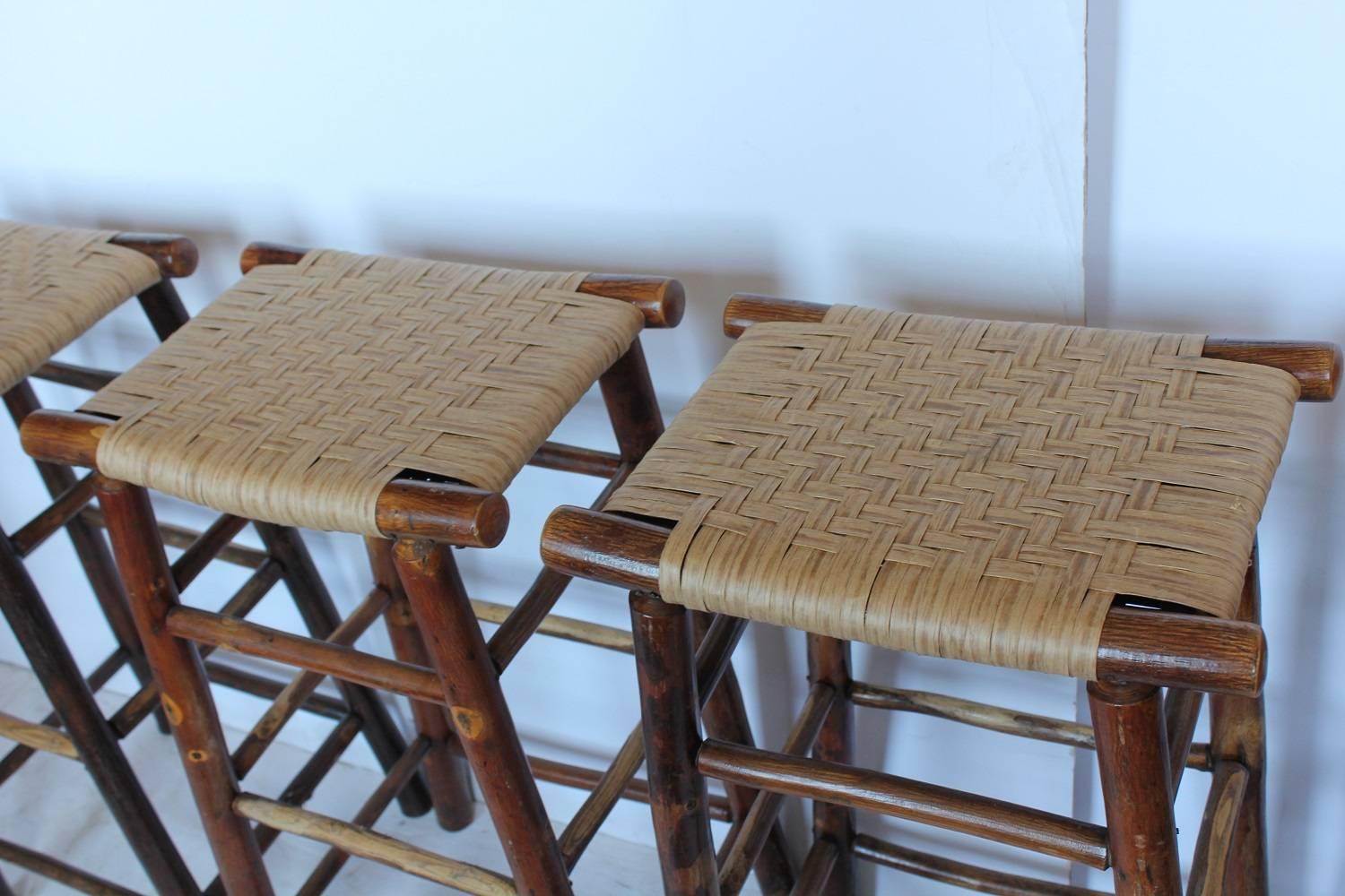 Original 1940s Adirondack bar stools with new woven seats.