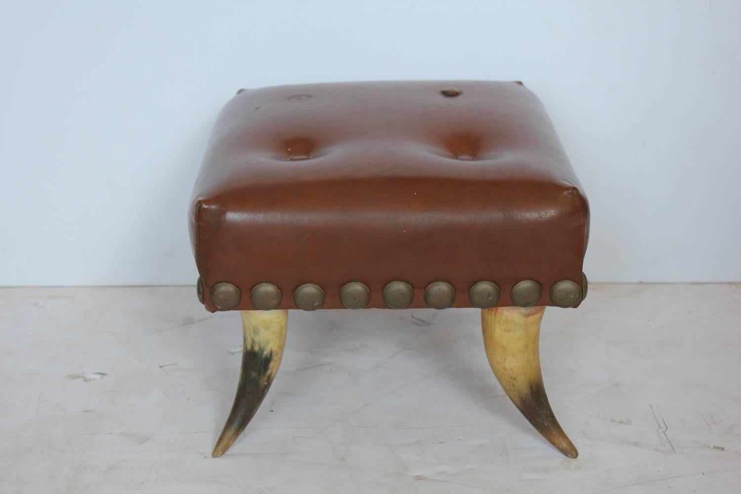 Antique horn and leather foot stool.