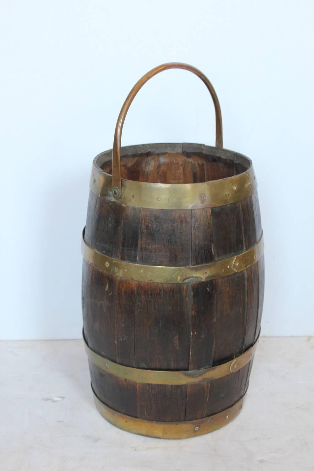 Antique brass and wood umbrella stand or waste basket.