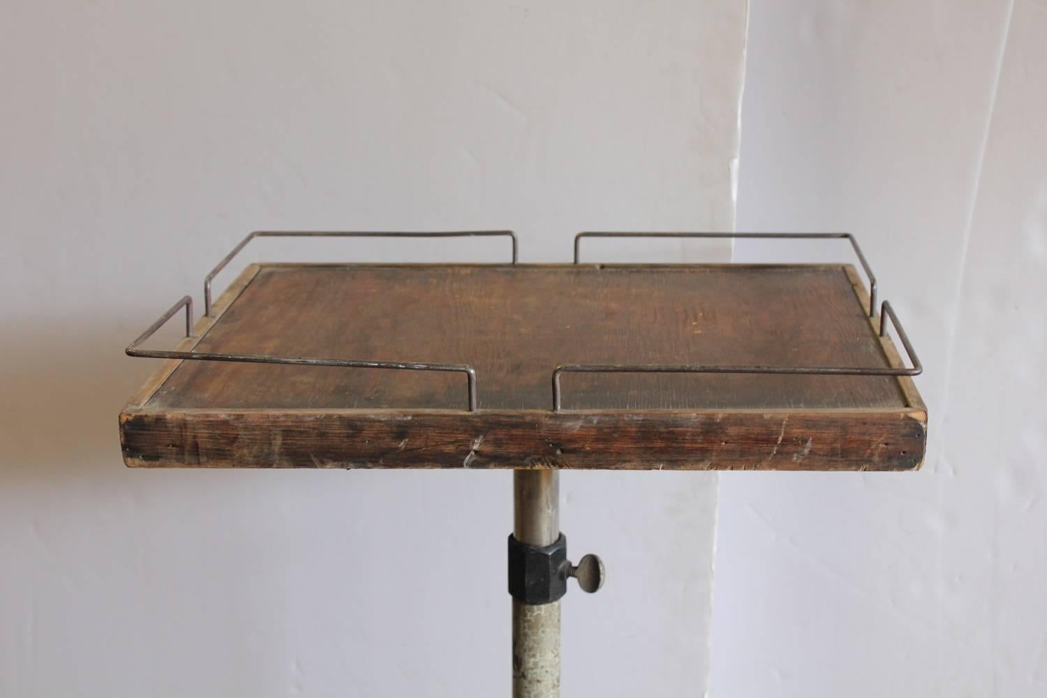 Antique Industrial adjustable side table. Measures: Height 46.5
