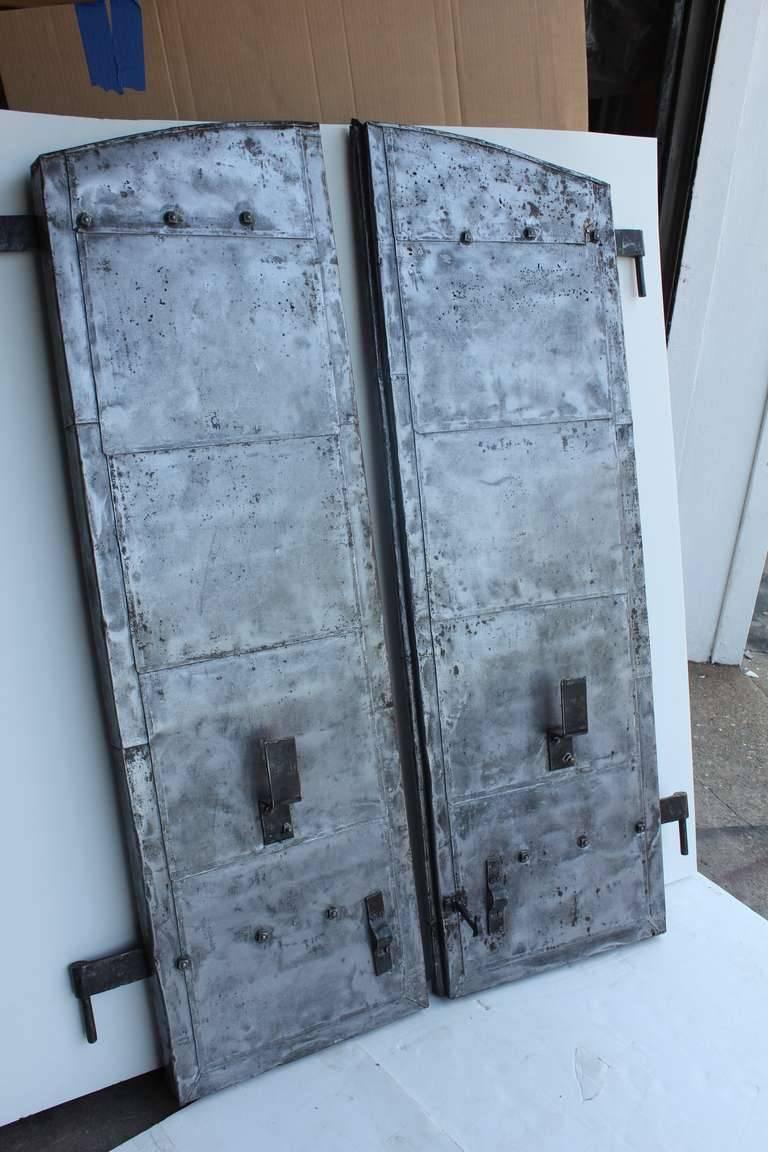 Antique distillery metal shutters. More sets available.
