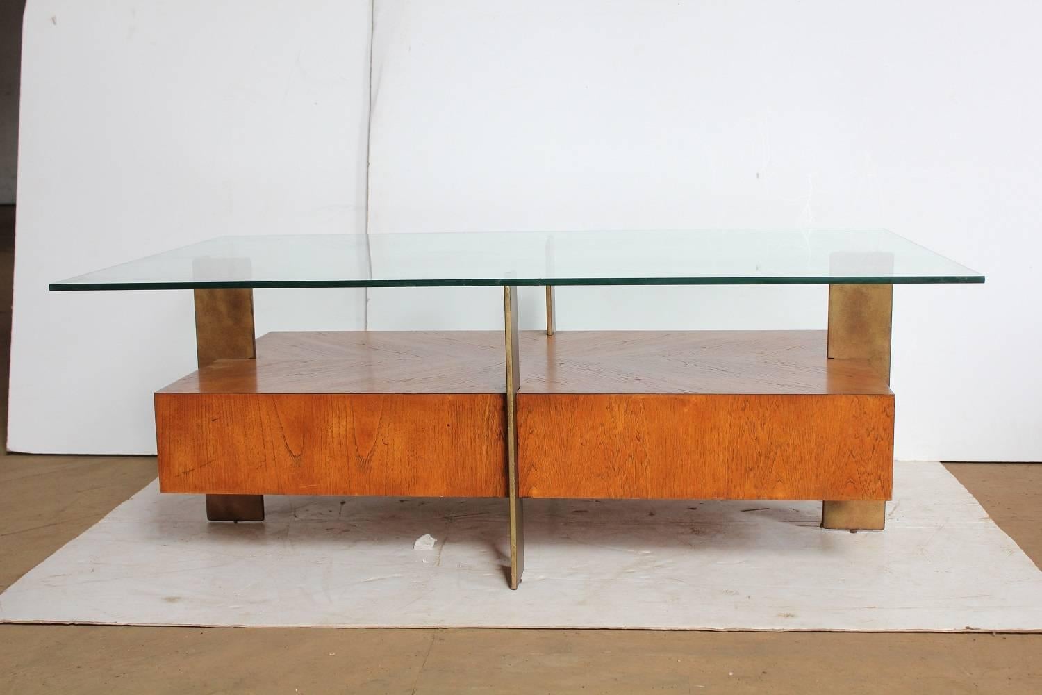 Modern wood and metal coffee table with glass top.