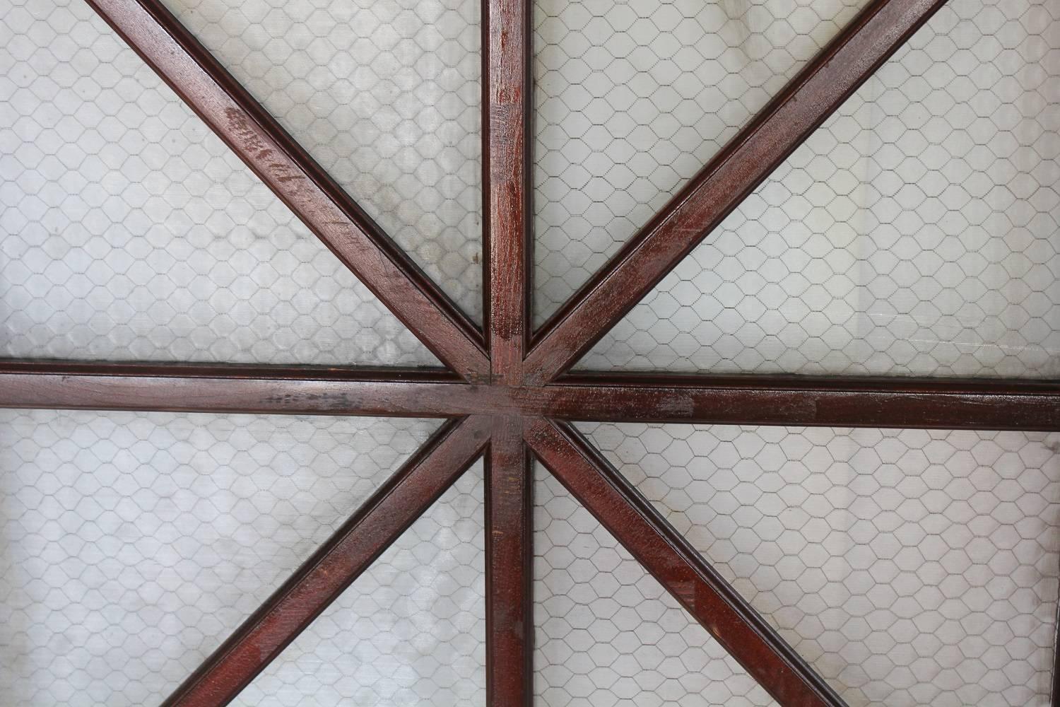 Early 1900s American wood and chicken wire glass window, two available.
