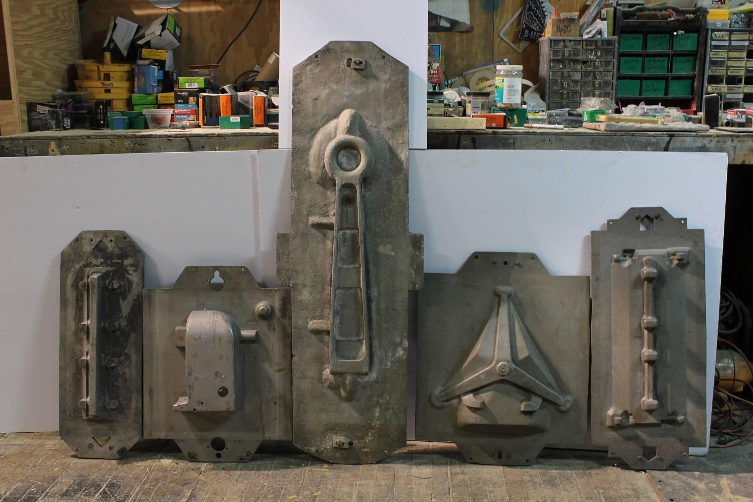 Collection of five large antique Industrial metal molds.