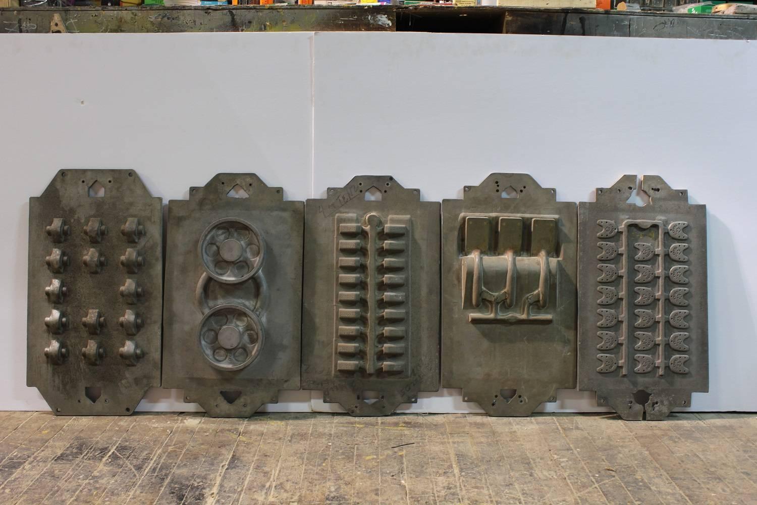 Collection of five large antique Industrial metal molds.