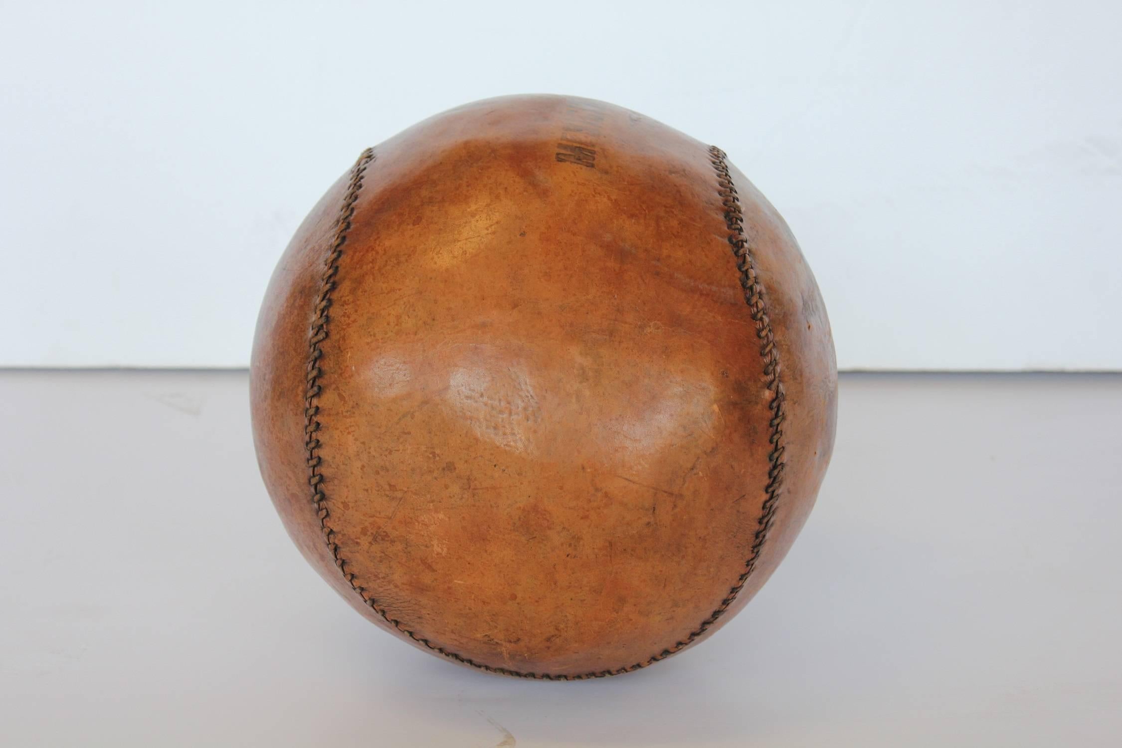 1950s hand-stitched leather medicine ball.