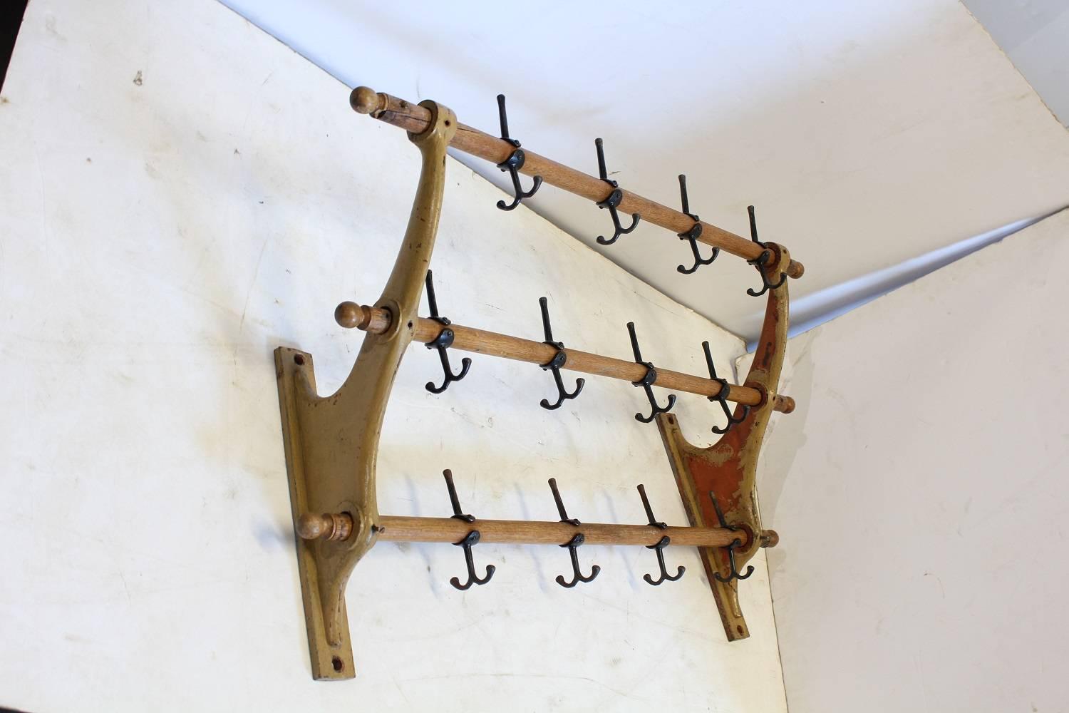 1900s school wall coat and hat rack with cast iron brackets.