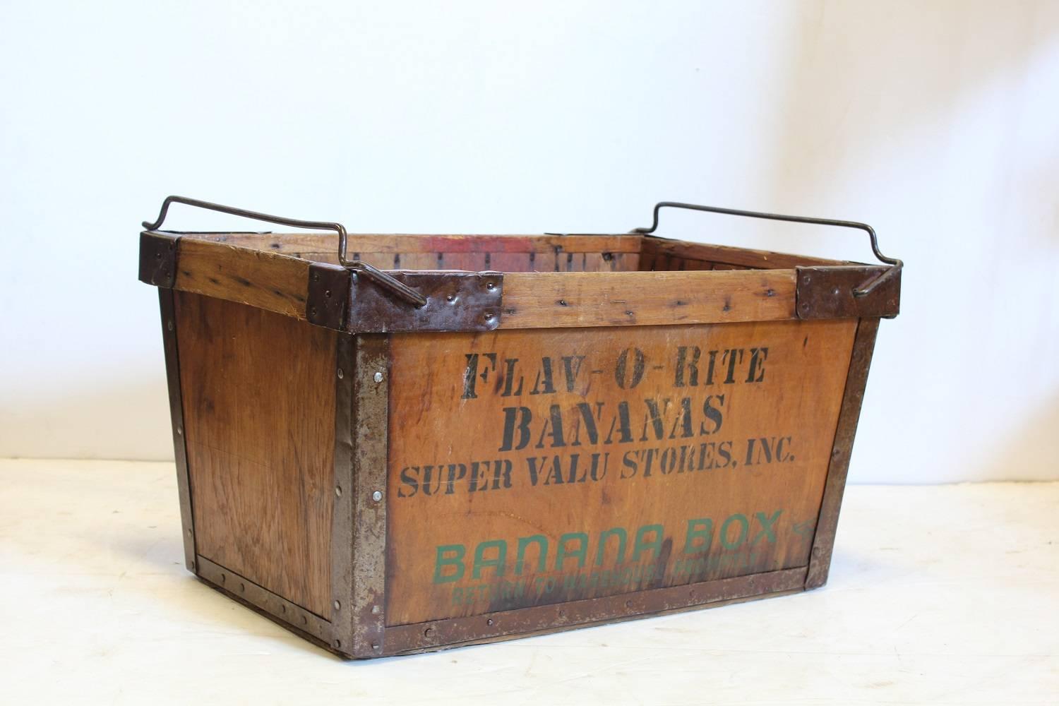 Vintage American banana crate with metal handles.