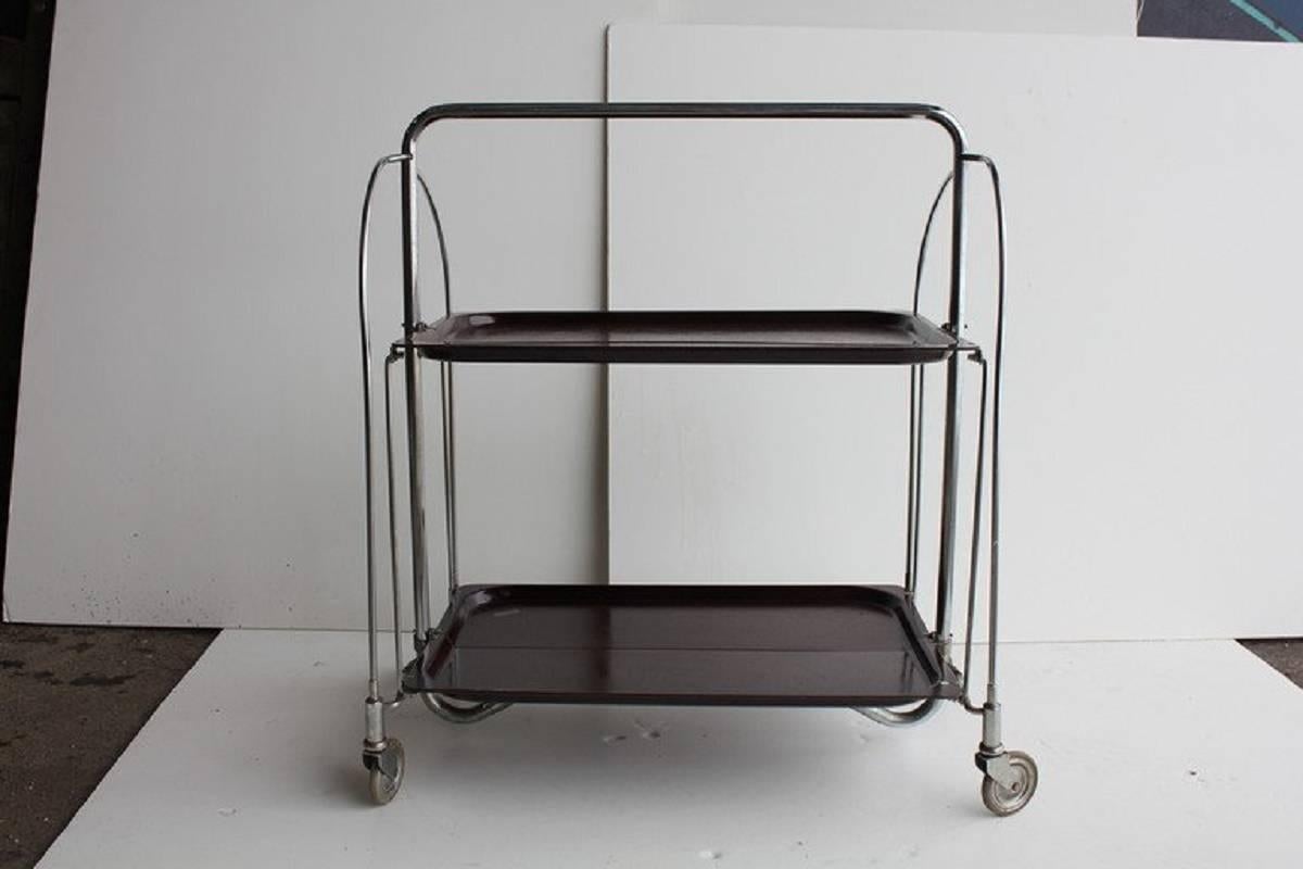 Mid-Century collapsible serving bar cart with chrome base and faux wood trays.