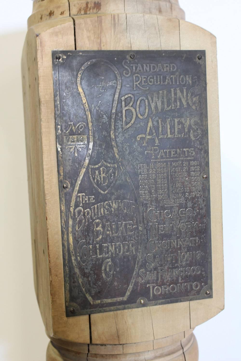 Antique bowling alley ball return post by Brunswick Balke Collender company.