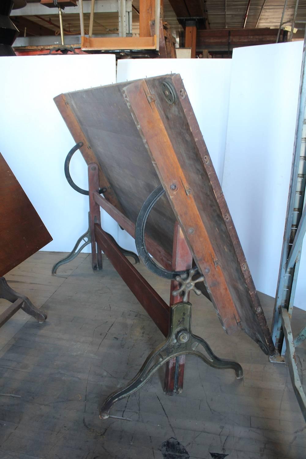 Antique American drafting table. Beautiful original paint on base. Measures: Height adjustable 32.5- 41.5