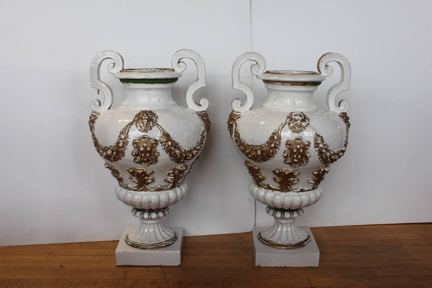 Antique Italian hand-painted glazed terracotta urns.