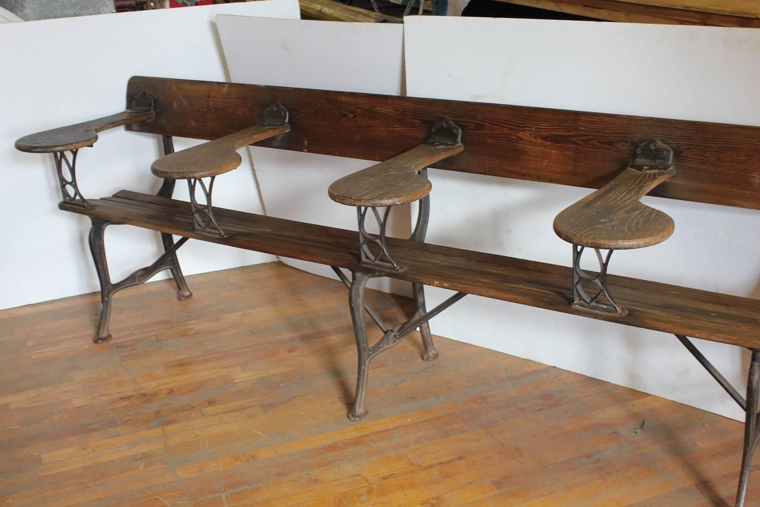 Antique American school bench with cast iron base.