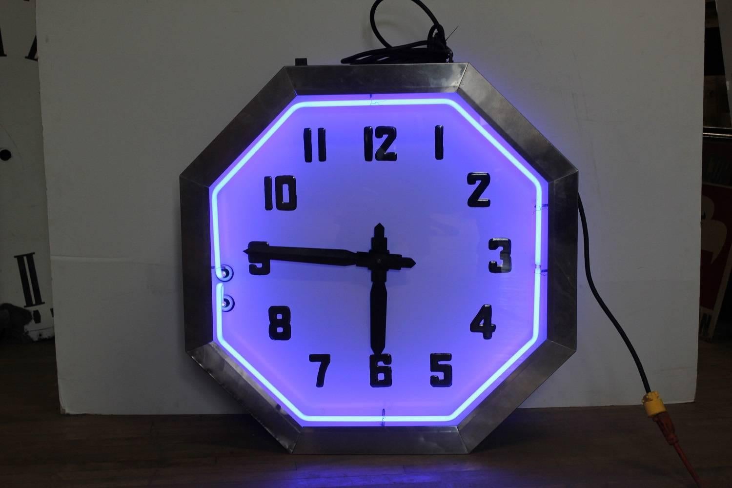 Large American double-sided neon clock with chrome frame and blue neon, 1930s. It does work. It is 32