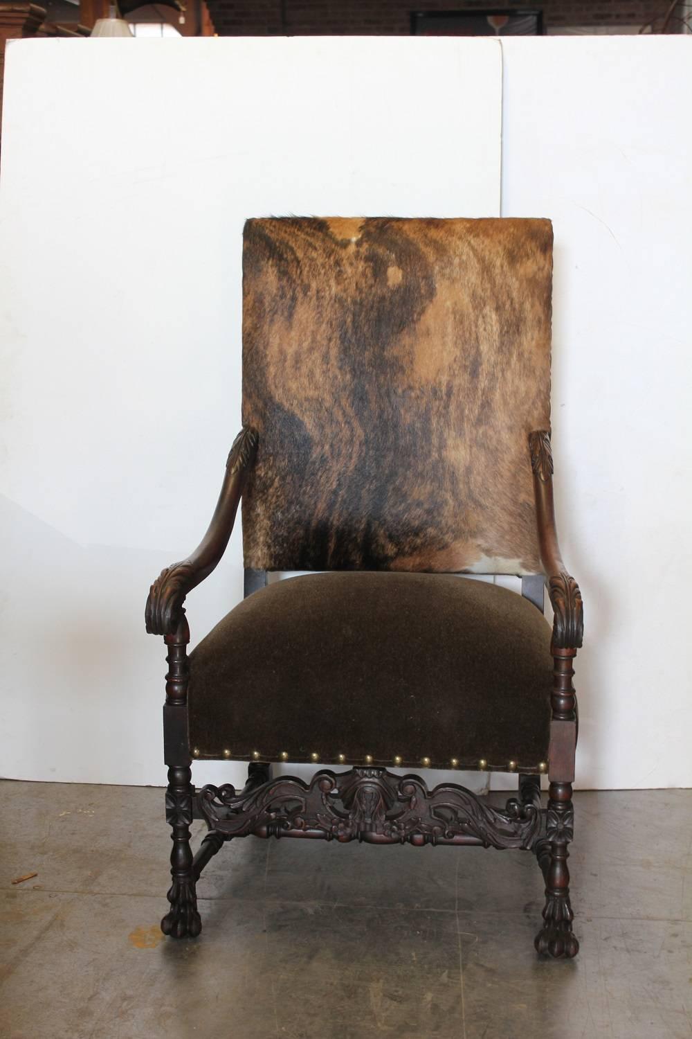 Spectacular 19th century French Louis XIV style carved walnut armchair with new cowhide and mohair upholstery.