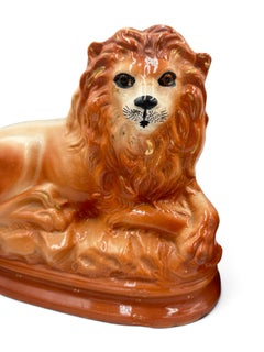 Pair of English Staffordshire Hand-Painted Lions with Glass Eyes, Circa 1900