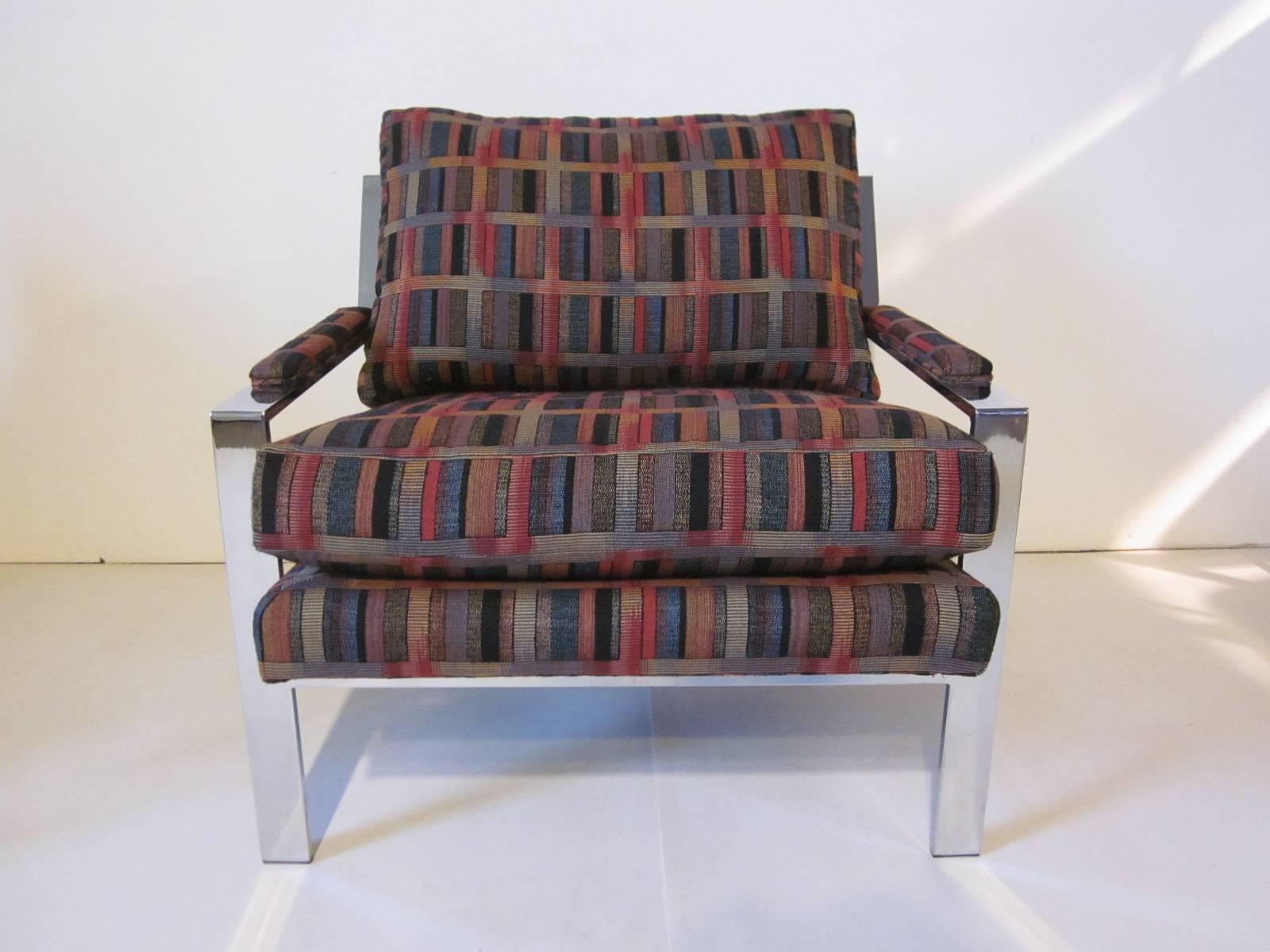 A pair of Baughman chrome framed lounge chairs with peaked rear arm and loose cushion construction, a Classic manufactured by Thayer Coggin furniture company.