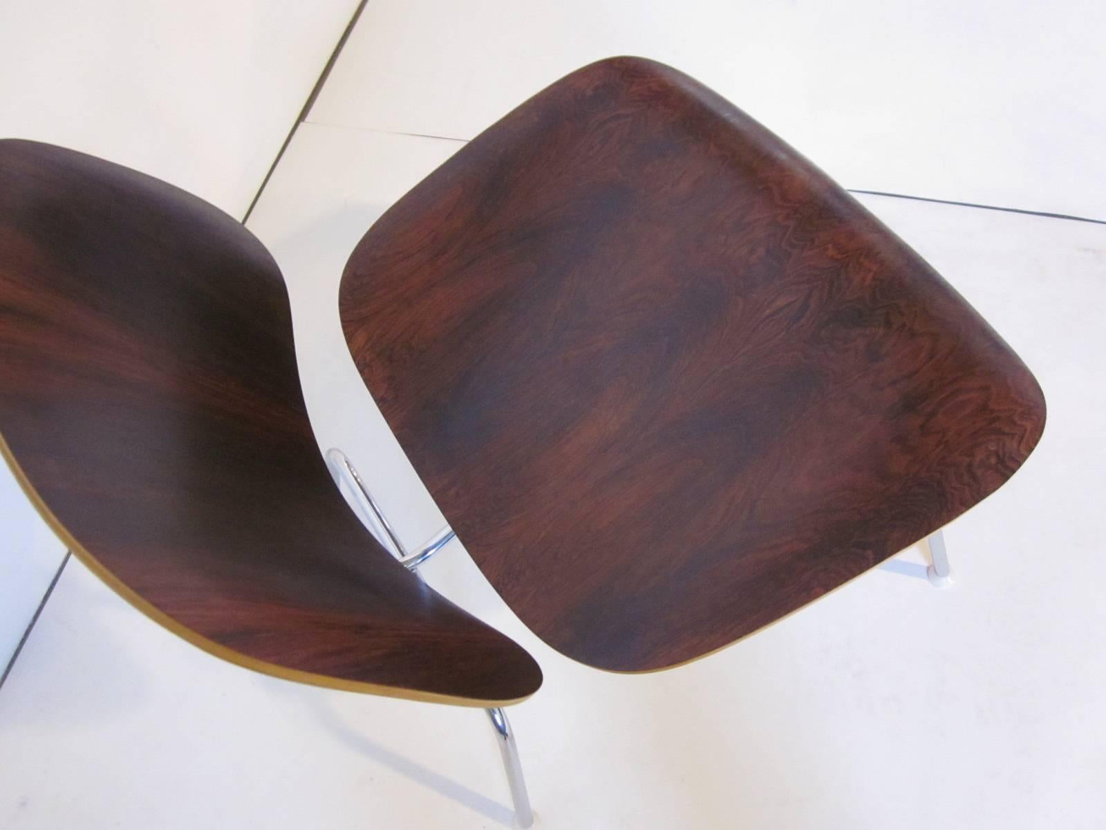 A rare special order Eames Brazilian rosewood LCM ( Lounge chair metal base ) the back and seat are in dark and rich rosewood sitting on a chromed steel base. Manufactured by the Herman Miller Company ,Zeeland Michigan. 