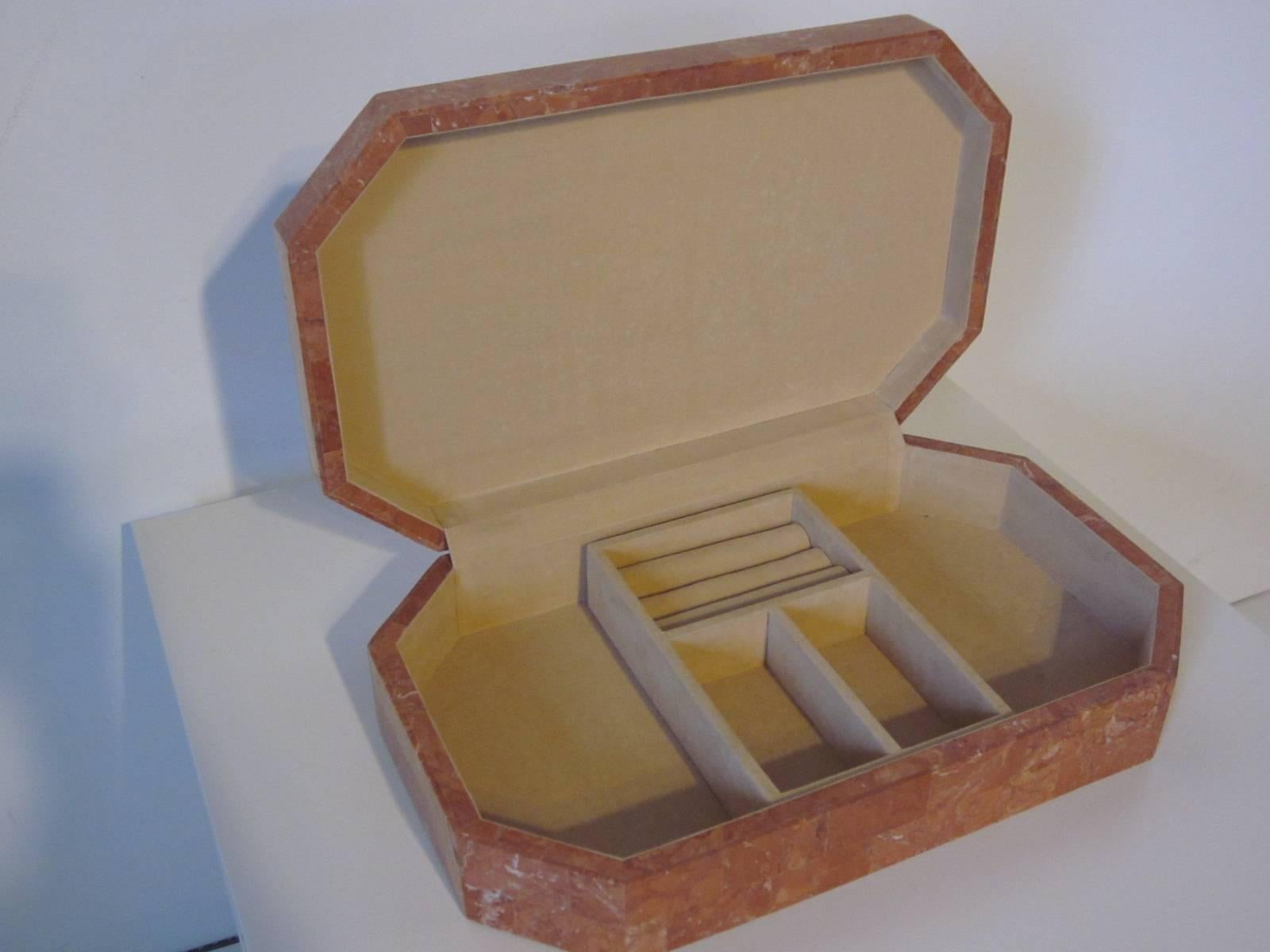 A tessellated marble jewelry box crafted by Maitland Smith in the style of Karl Springer with hinged top, velvet lining and contains a removable small item tray.