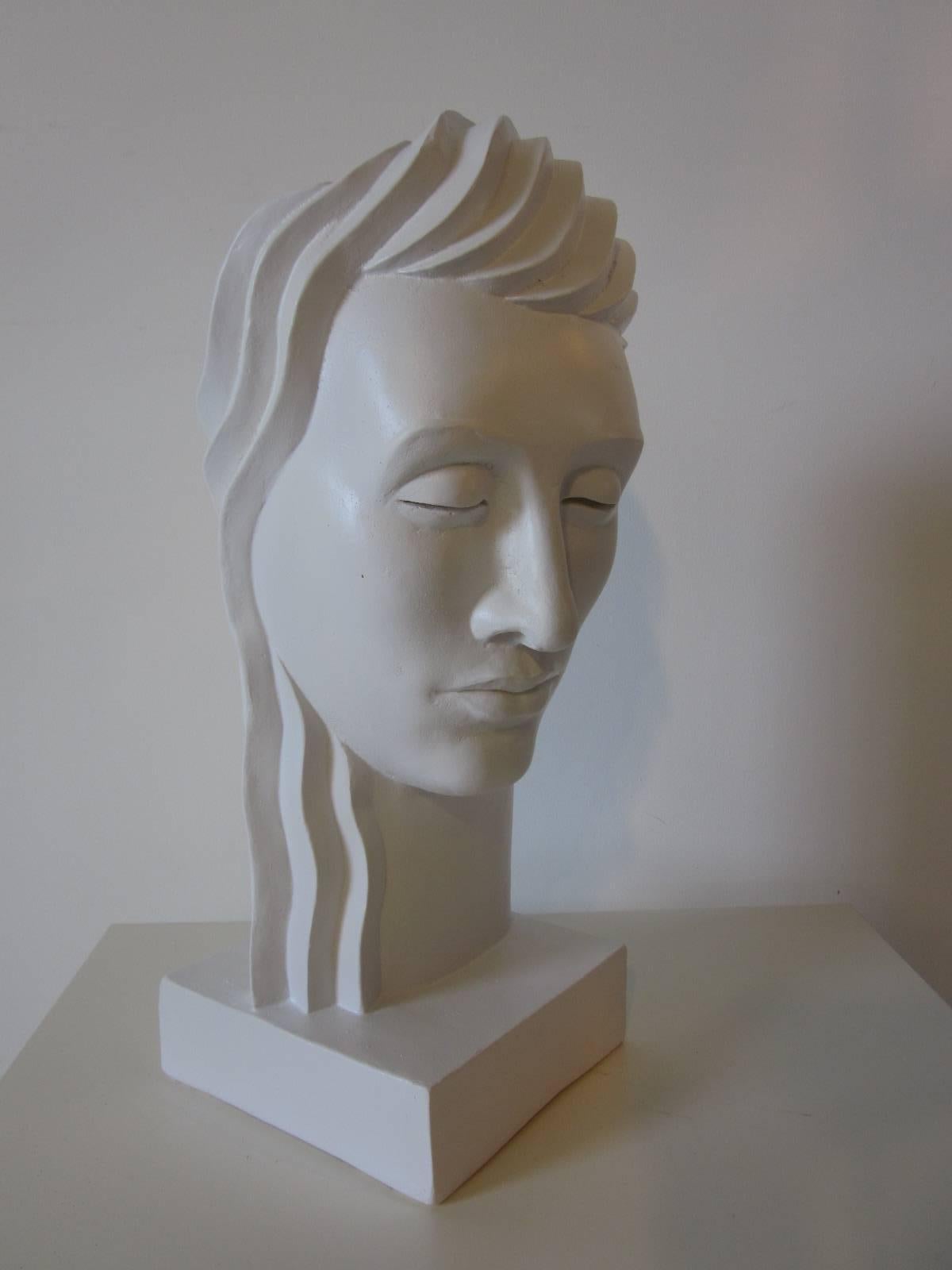 Art Deco styled female bust plaster casted in the 1980s by White Art Company imprinted to the reverse lower base.