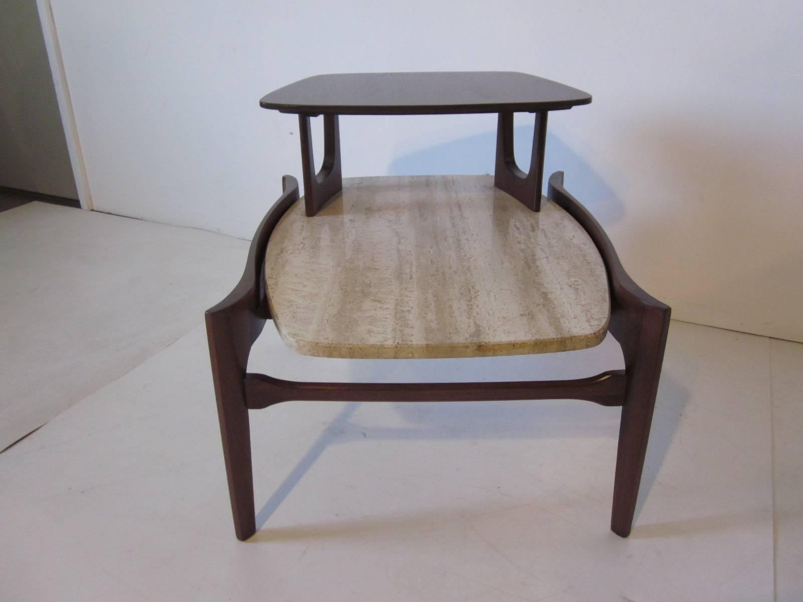 A dark walnut end / side table with wonderful Italian travertine marble top and sculptural designed frame designed for Gordon Furniture Company.
