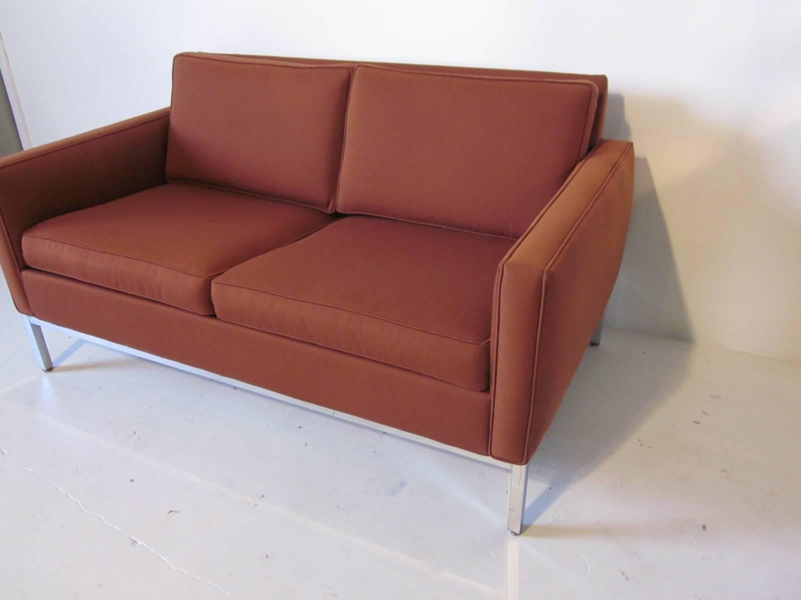 A smaller loveseat sofa with an aluminum square tubed framed base and two cushion seat in the manner of Florence Knoll.