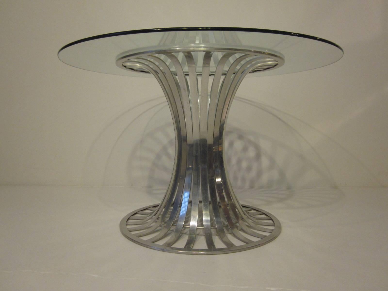 A aluminium banded tulip styled dining / game table with plate glass top, a lite airy look with a dash of Modern .