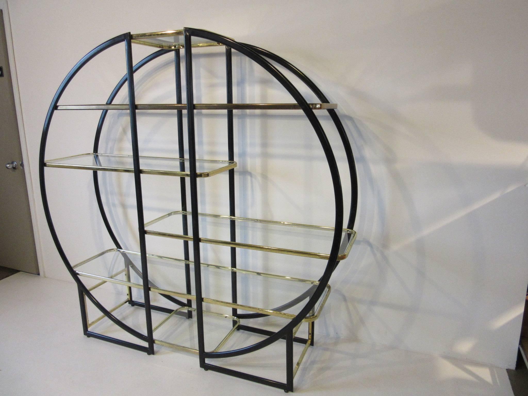 A six-shelve brass and satin black French styled Etagere with smaller shelves to the top and bottom and off set larger shelves to the centre.