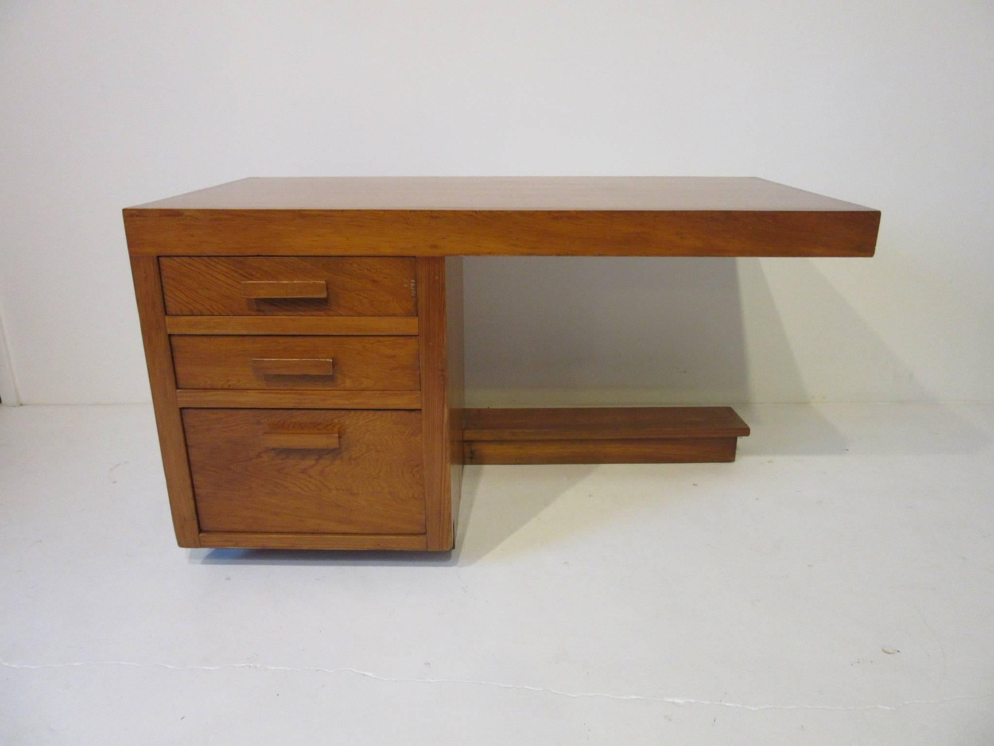 An important and rare Frank Lloyd Wright desk made for the Levin House in Kalamazoo Michigan. This desk comes from the first house built in Parkwyn Village a planned Community of Usonian homes. Formed by a group of forward thinking employees of the