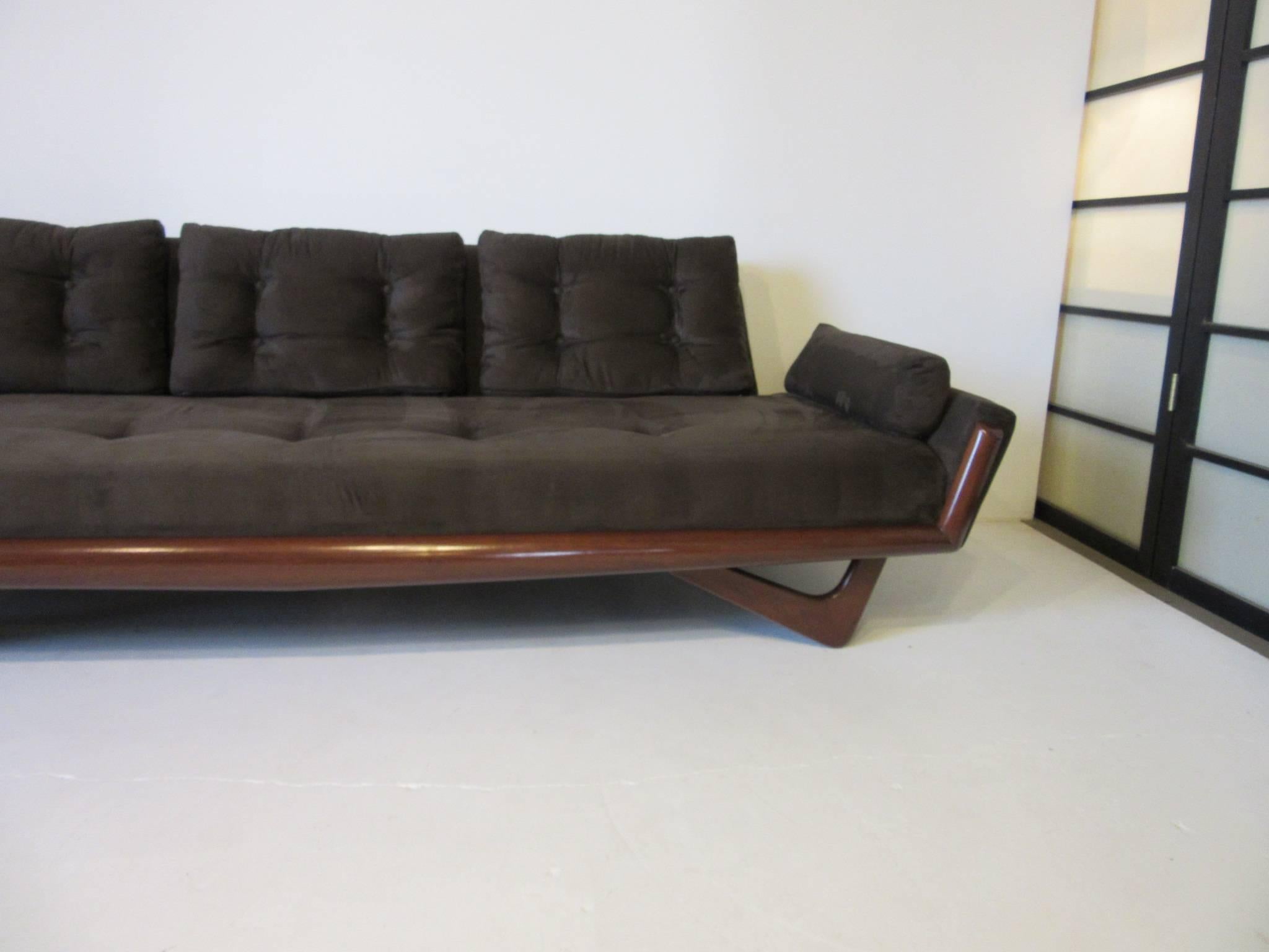 An Adrian Pearsall sofa model number 2404-s with dark toned sculptural wood frame and upholstered in a rich chocolate ultra suede. Manufactured by Craft Associates.