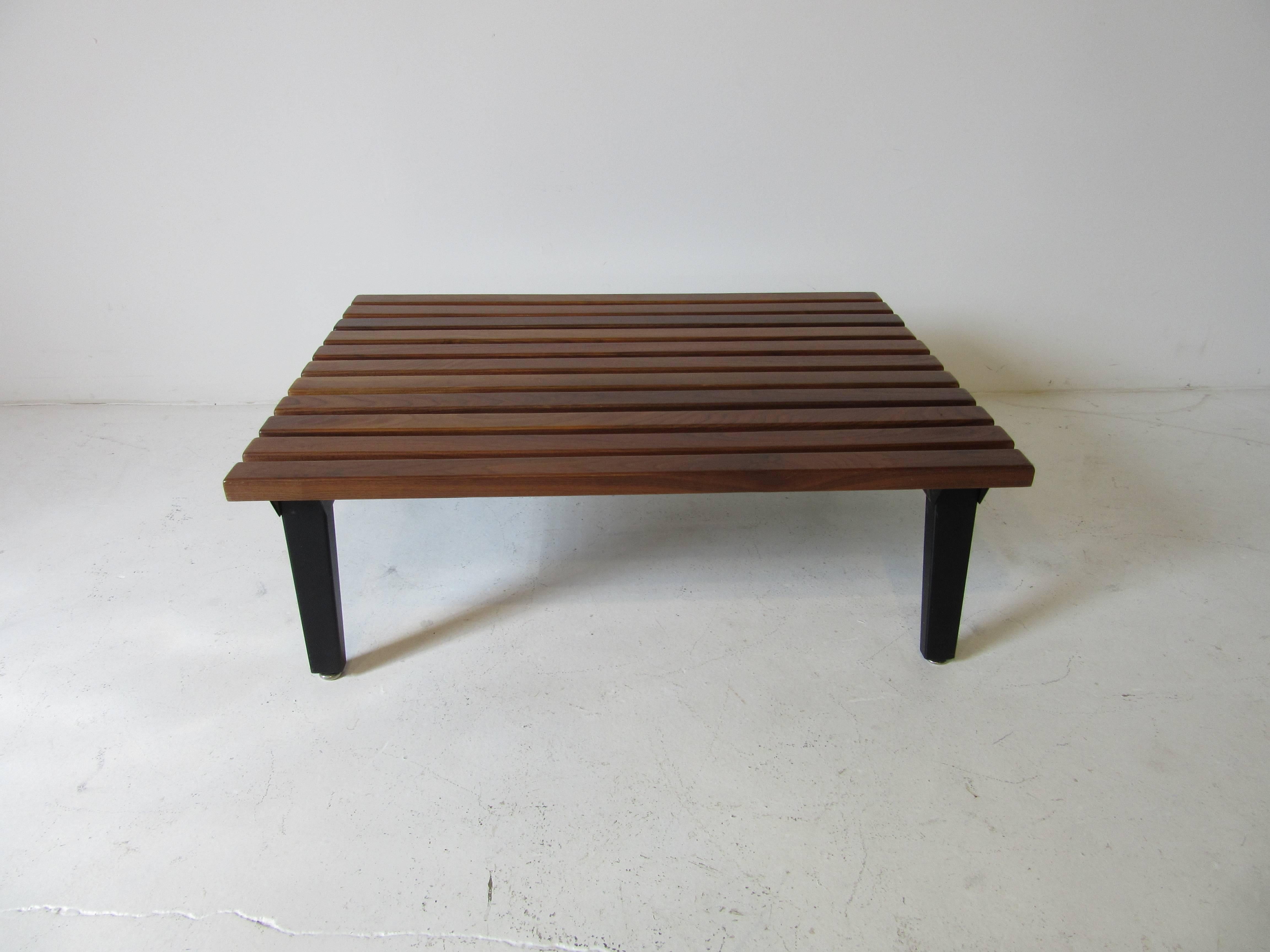 A very rare dark walnut slat wood coffee table with satin black steel frame bought from a retired Herman Miller employee . Manufactured by the Herman Miller Furniture Company.