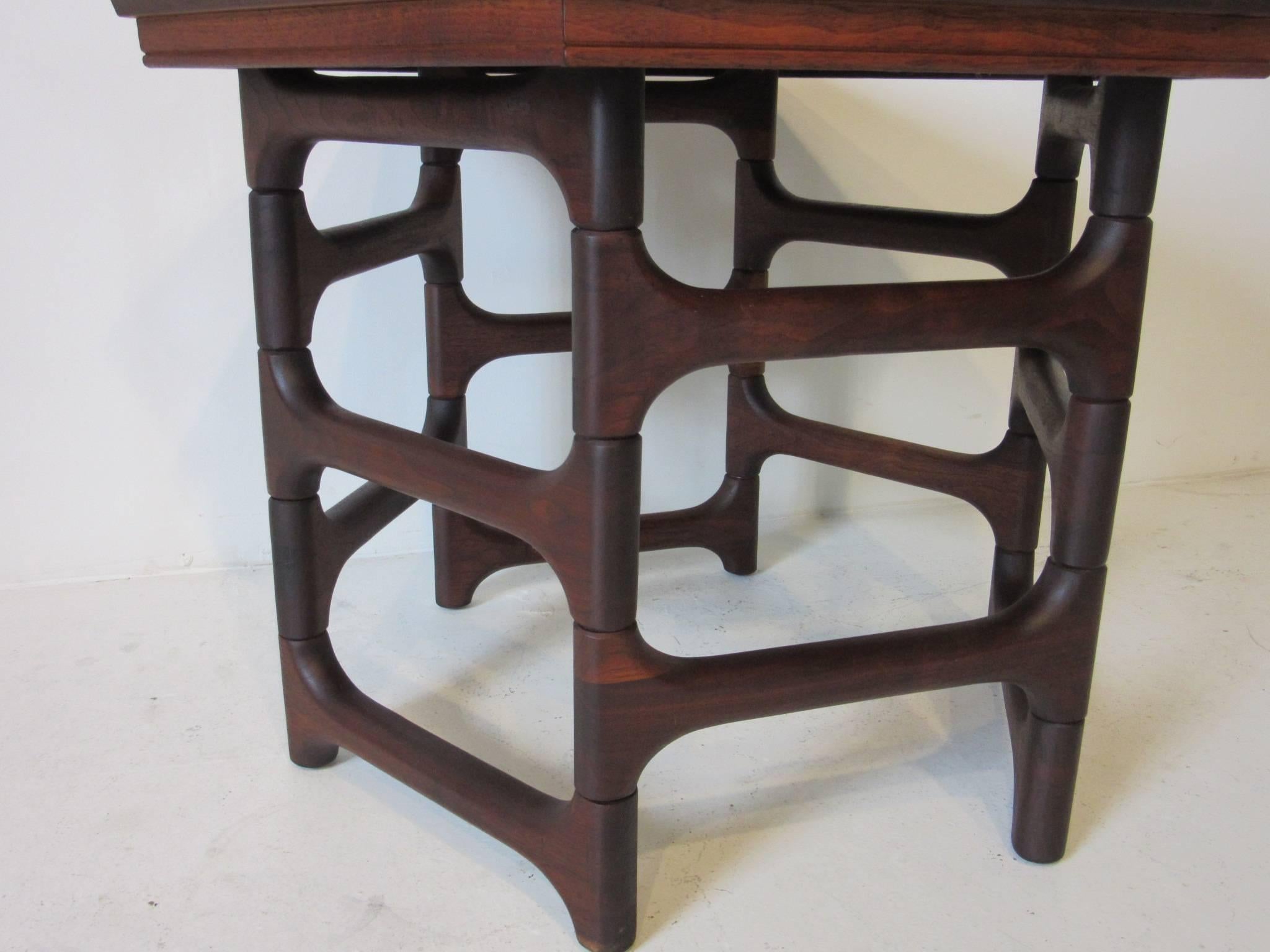 A wonderfully designed dark walnut side table with hexagon inlay wood top and sculpted wooden base in the style of the modern studio artists Michael Coffey, Angel Pazmino and Phillip Lloyd Powell.