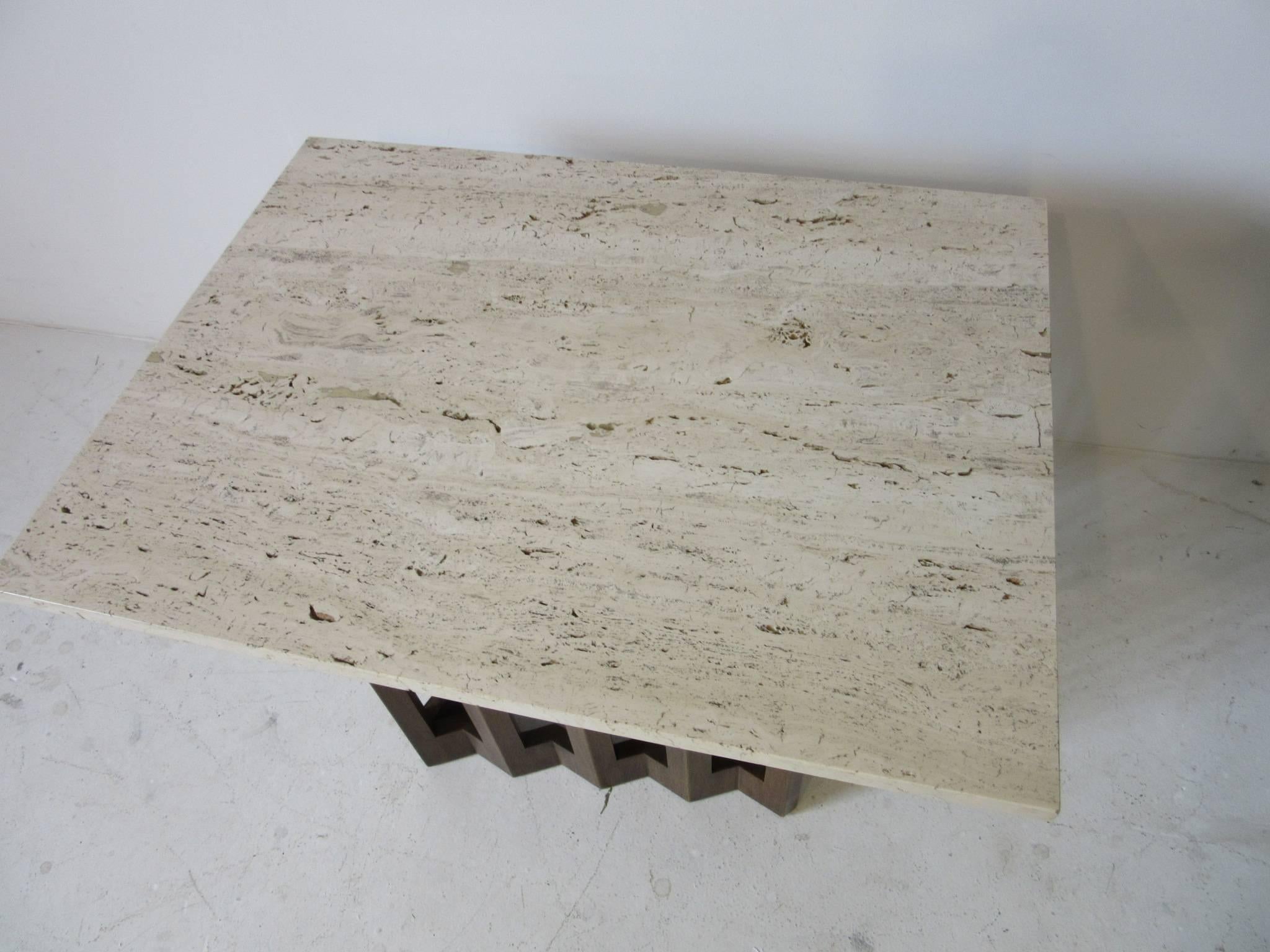 An Italian terrazzo marble topped end table with a sculptural wood base in the manner of Harvey Probber and marked to the bottom of the marble MDC made in Italy.