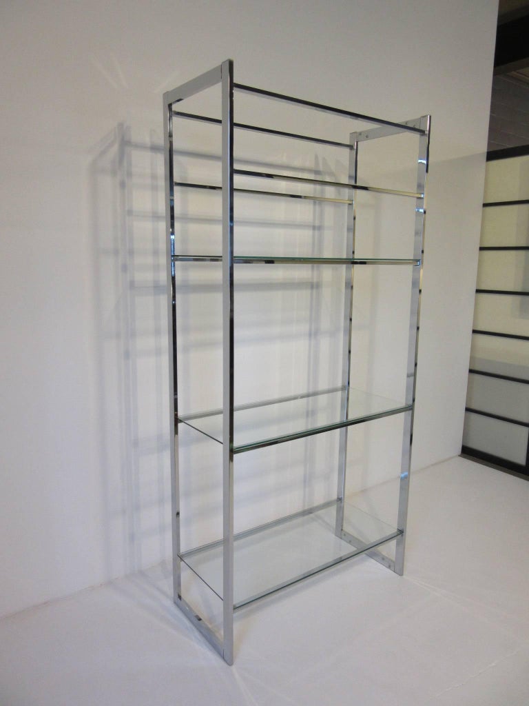A five chrome and glass shelved etagere in the manner of Milo Baughman with over sized middle area for larger sculptures and decorative objects.