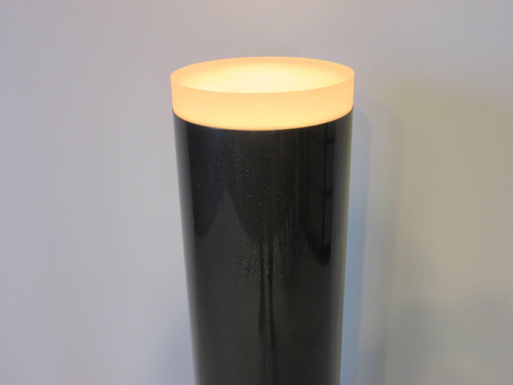 A Lucite Memphis styled column pedestal finished in a gun metal gray hammer coating with step up base and thick frosted Lucite light up top and foot control switch the top diameter is 10.75