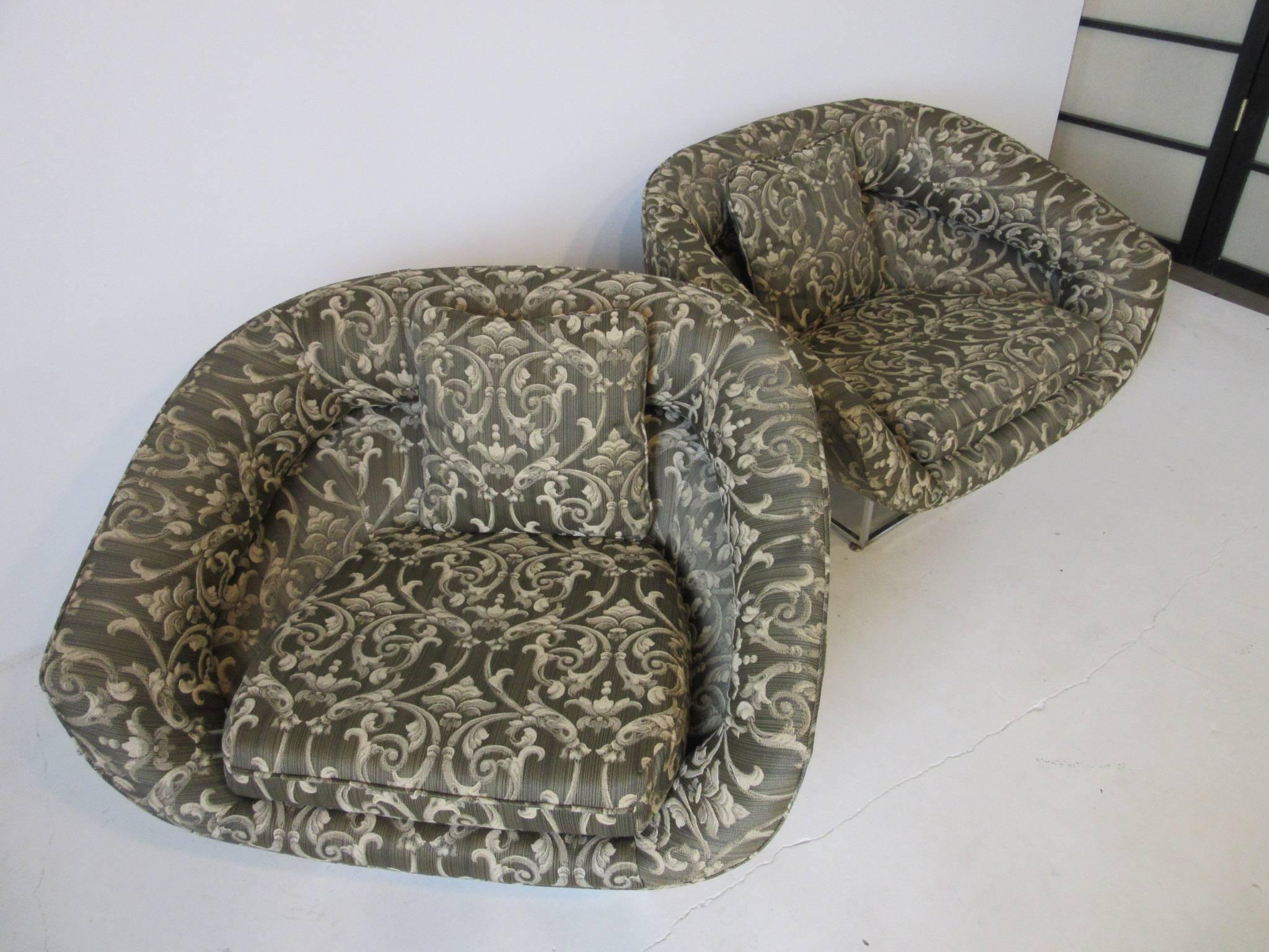 A pair of Milo Baughman barrel or tub styled lounge chairs with square chrome tubed base, loose back and bottom cushions and reupholstered in a barque patterned fabric. The perfect matched look for a modern design and a rich opulent feel,