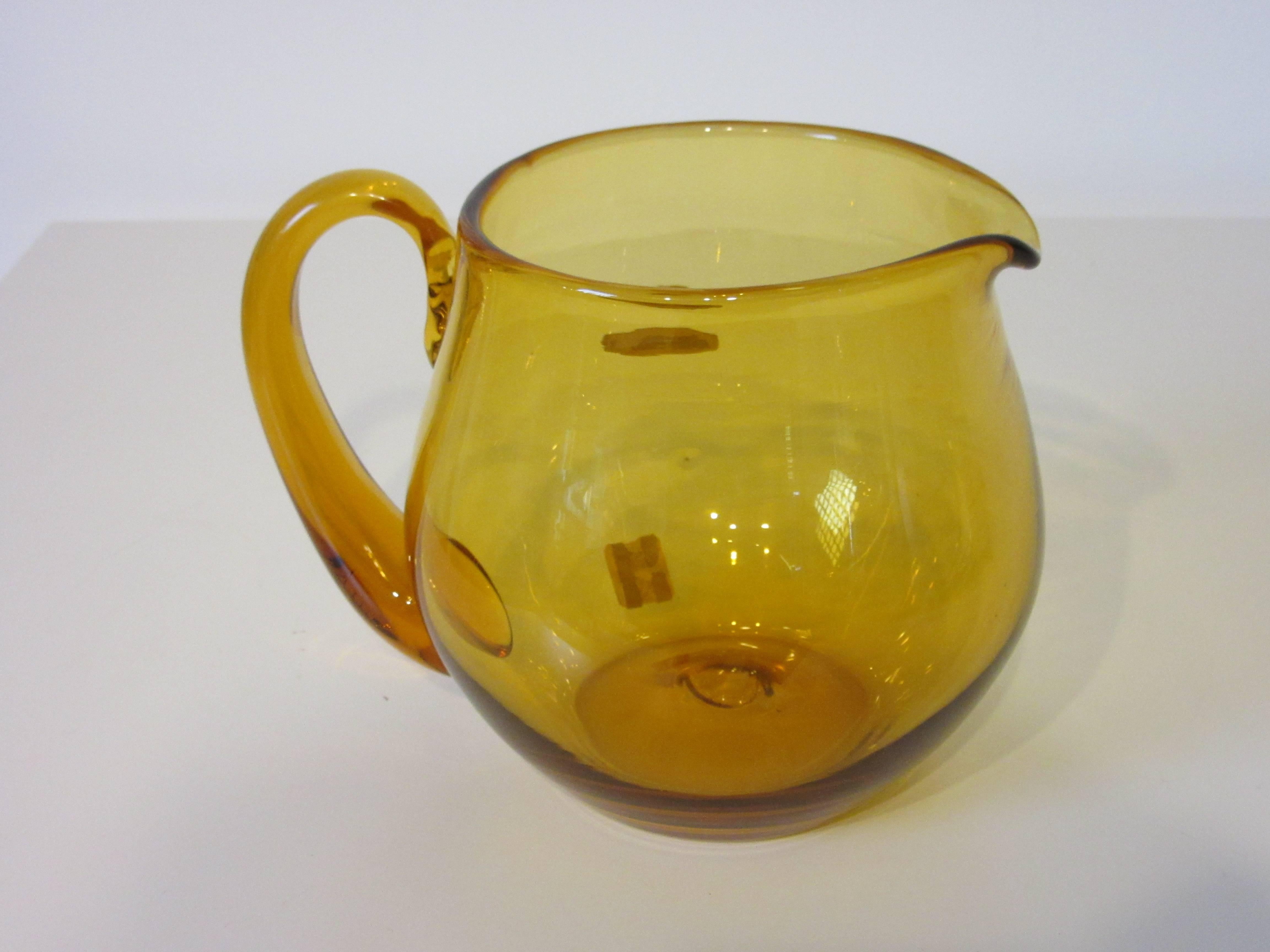 A Blenko yellow toned handblown pitcher.
