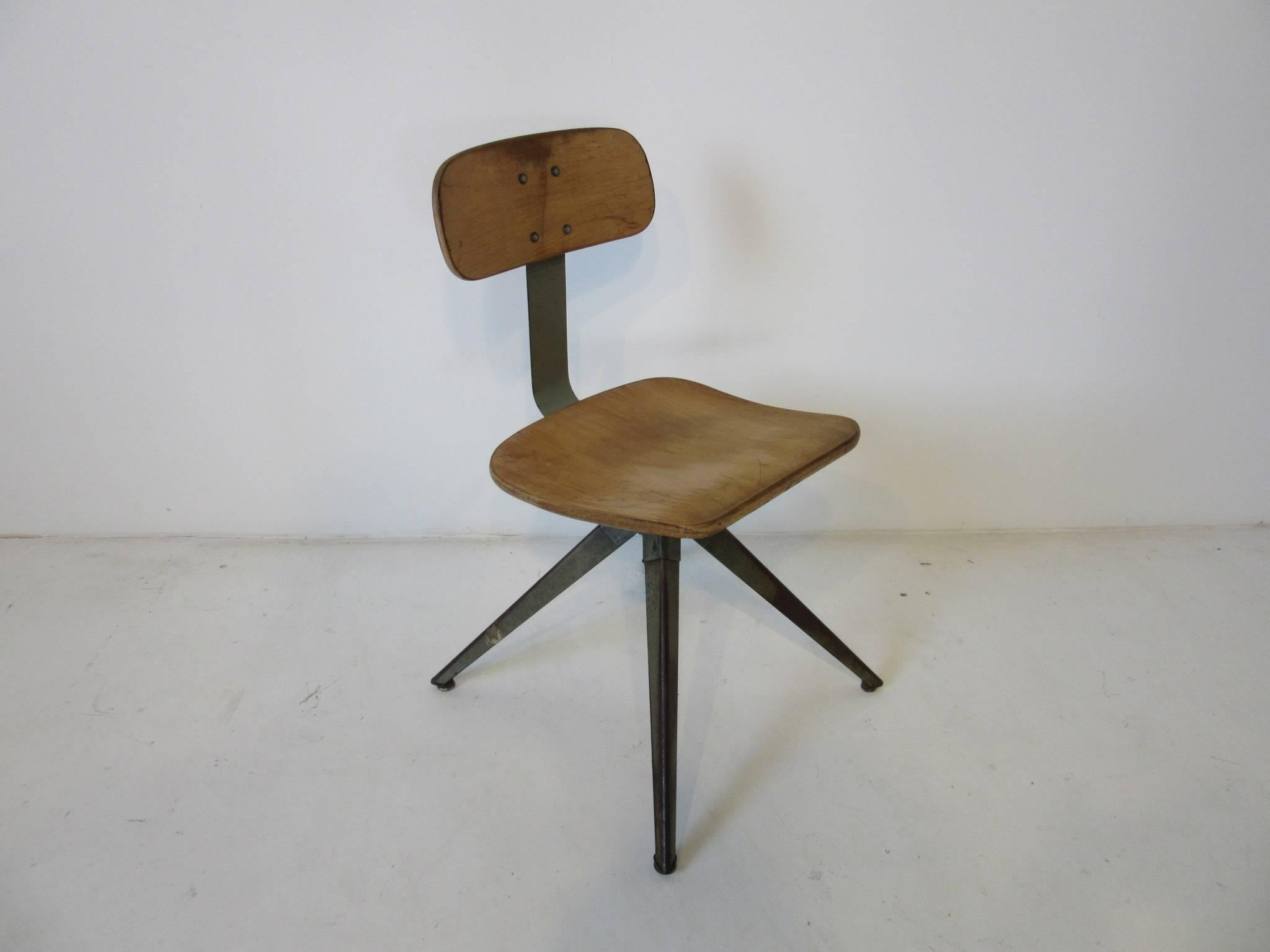 A splayed leg and metal spine styled desk / side chair with molded plywood seat back and bottom, foot pads are attached to each leg to ensure stability. A great industrial form in the manner of Odelberg Olsen and Prouve.
