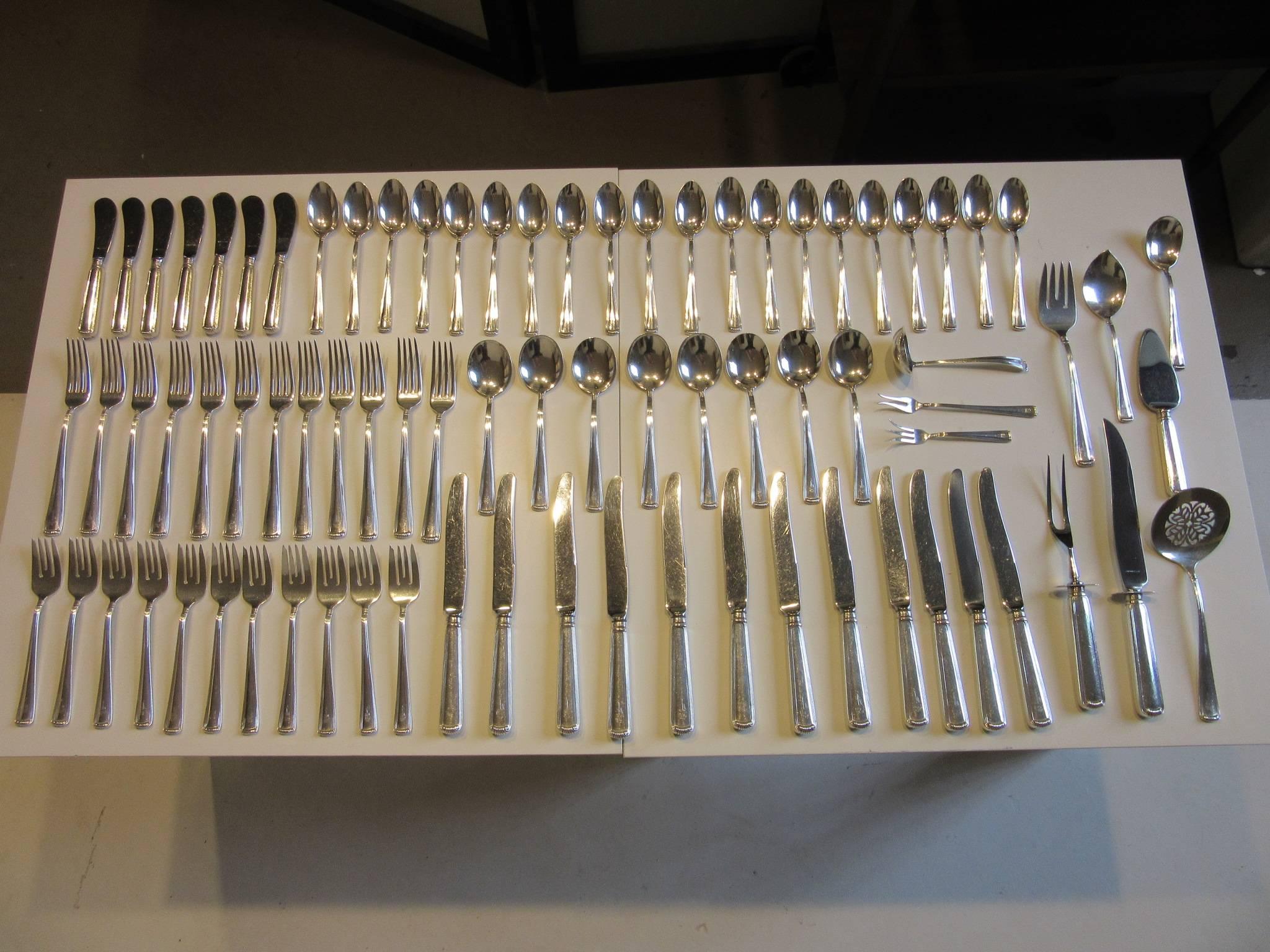A 80-piece sterling silver flatware set crafted by The Frank Herschede Co. Cincinnati, Ohio in a very clean and simple stylish pattern with t monogram and great servers.
12 dinner forks
11 salad forks
20 tea spoons
Eight soup spoons
12