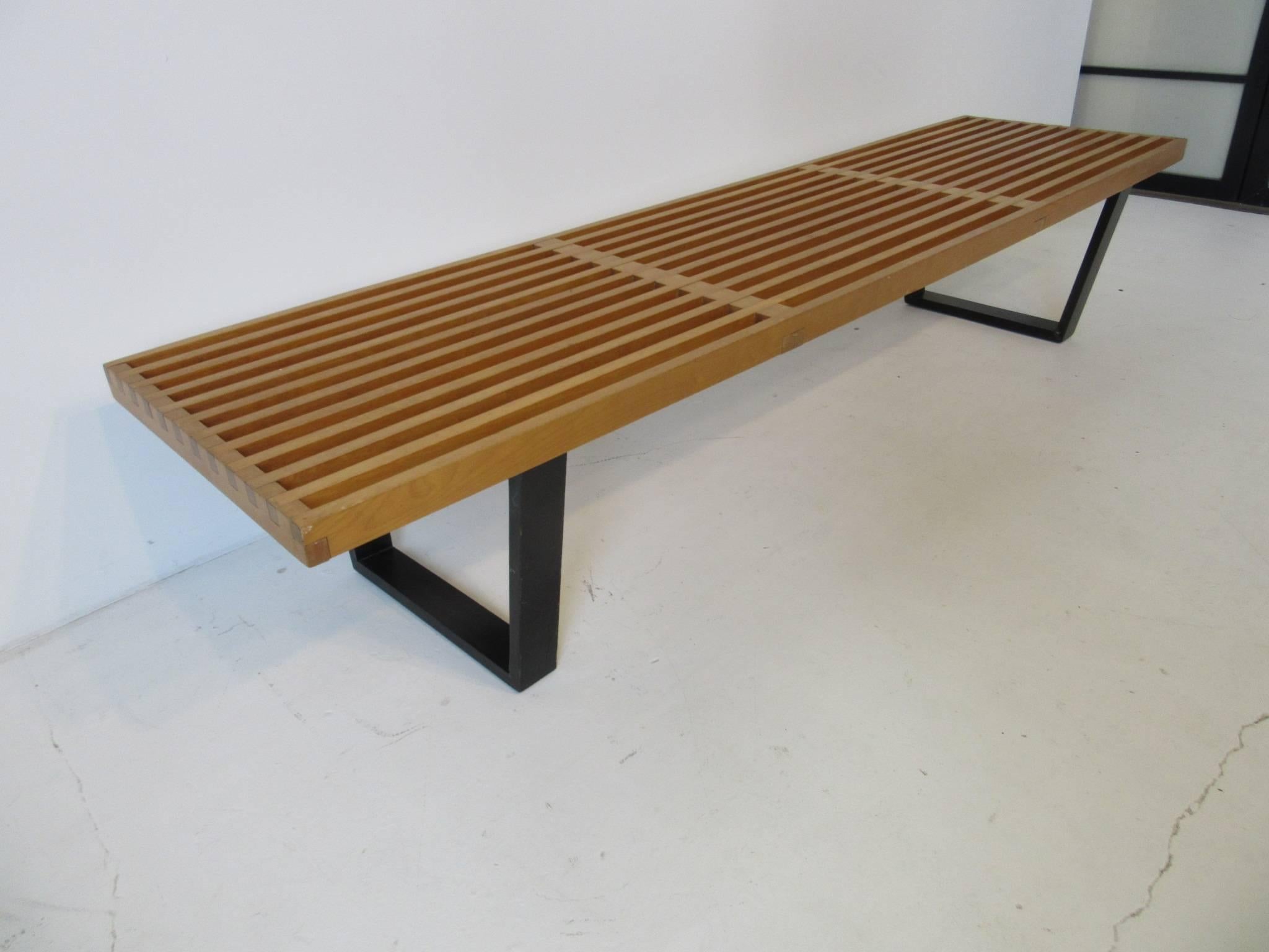A vintage wooden Nelson platform slat bench or coffee table with satin black legs, perfect for that entrance way, living space or at the foot of the bed. Manufactured by the Herman Miller furniture company.