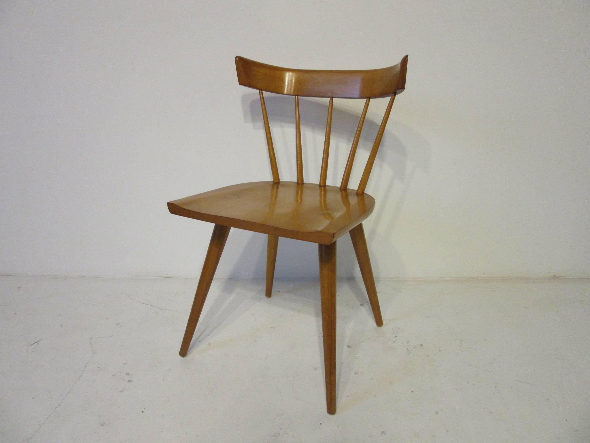 A set of six maple McCobb spindle back planner group dining chairs, a simple and well made design from the 1950s.