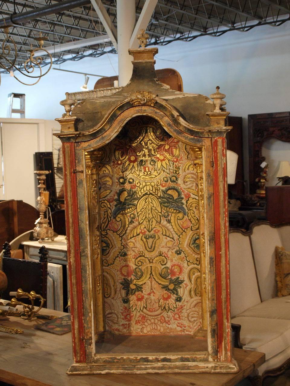 An outstanding 17th century Spanish tabernacle, niche in polychromed and giltwood. The cabinets were used to display statues of saints. Beautifully constructed with a curvilinear roof and three opening door frames.