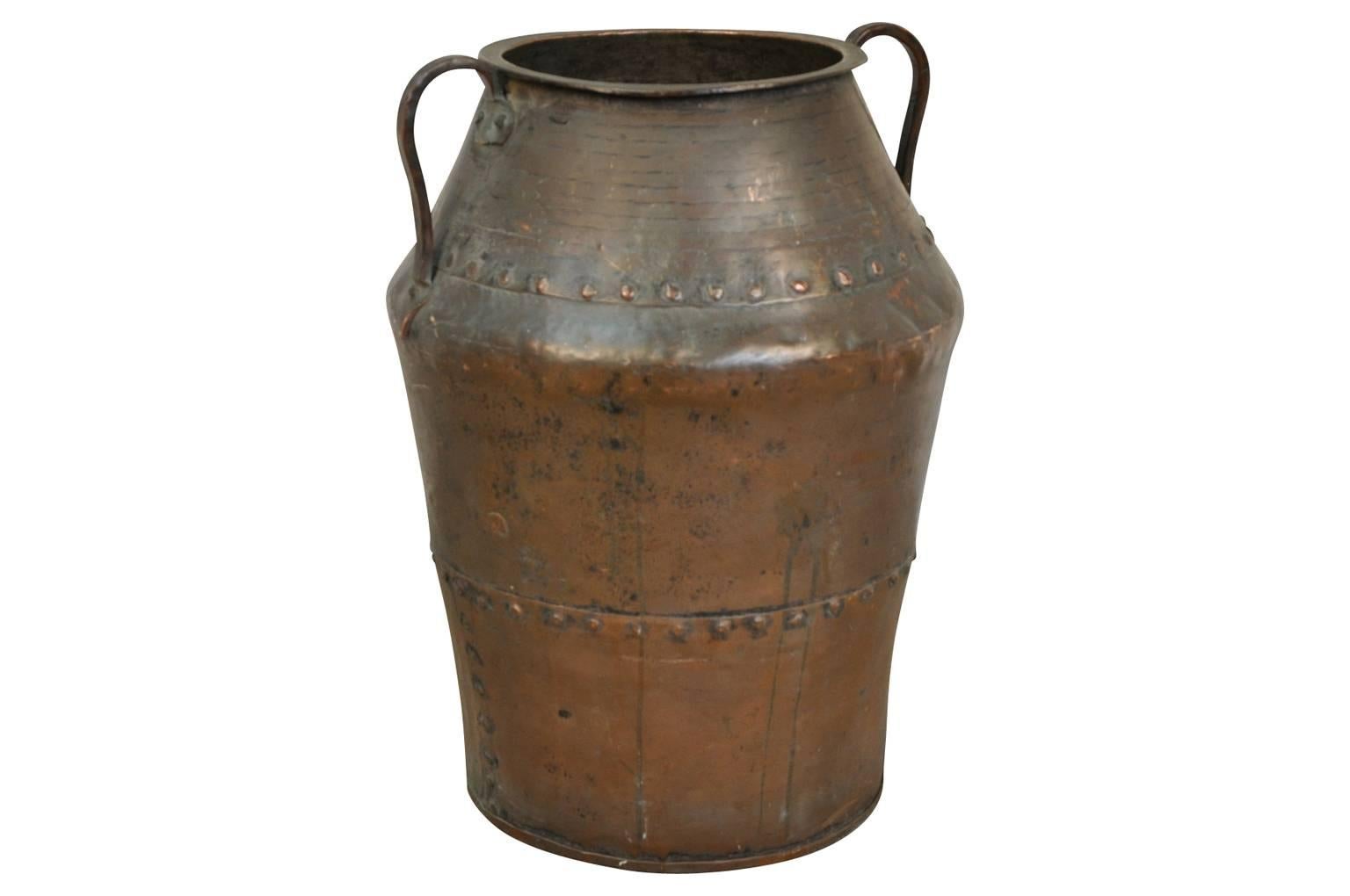 A terrific 18th century copper vessel from Northern Italy. Wonderfully crafted in riveted heavy gauge copper. An excellent umbrella or planted as a jardiniere.