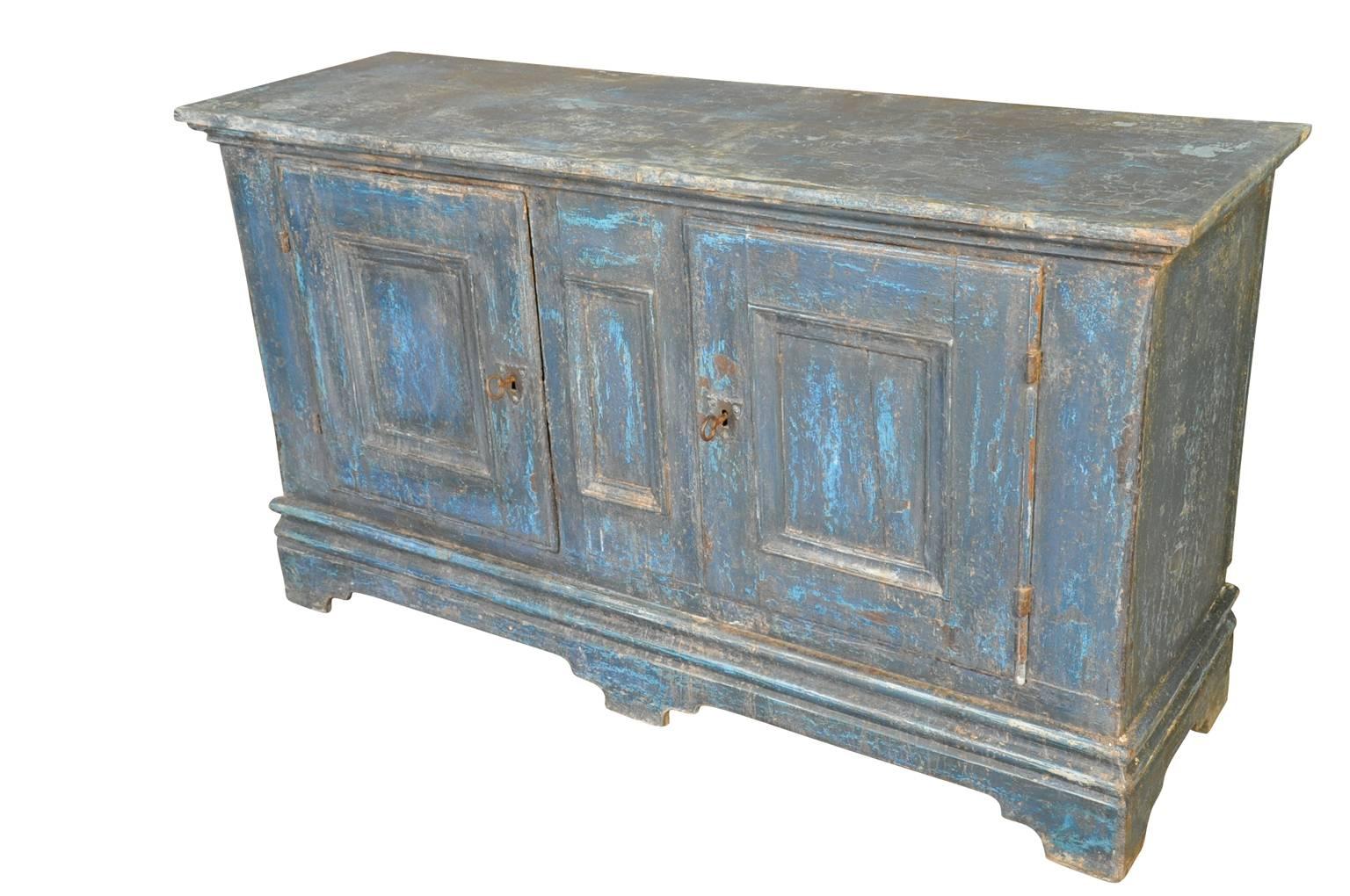 A wonderful pair of French 18th century buffets cabinets - enfilades in painted wood.  Terrific painted finish in hues from azure to turquoise.  Wonderful storage pieces that will add charm and character to any room.  The cabinets may be sold as a