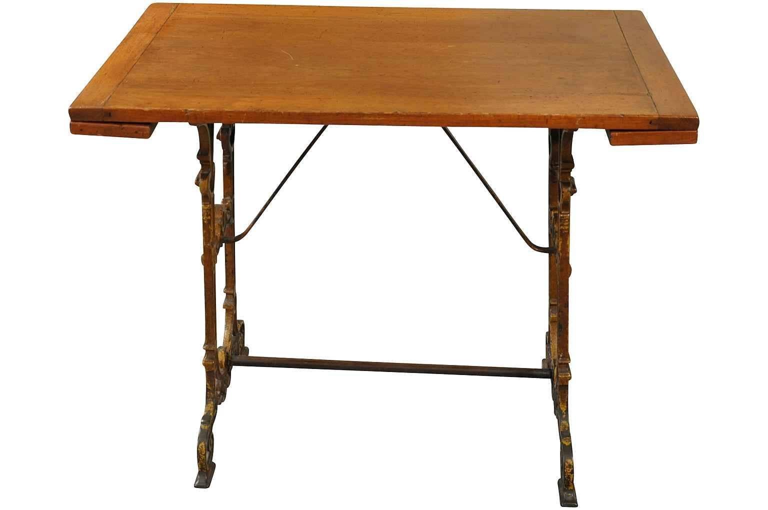 A charming late 19th century French Bistro table constructed with a very handsome cast iron case with a wooded top. The wooden top extends from both ends. With both extensions opened, the width is 45 3/8