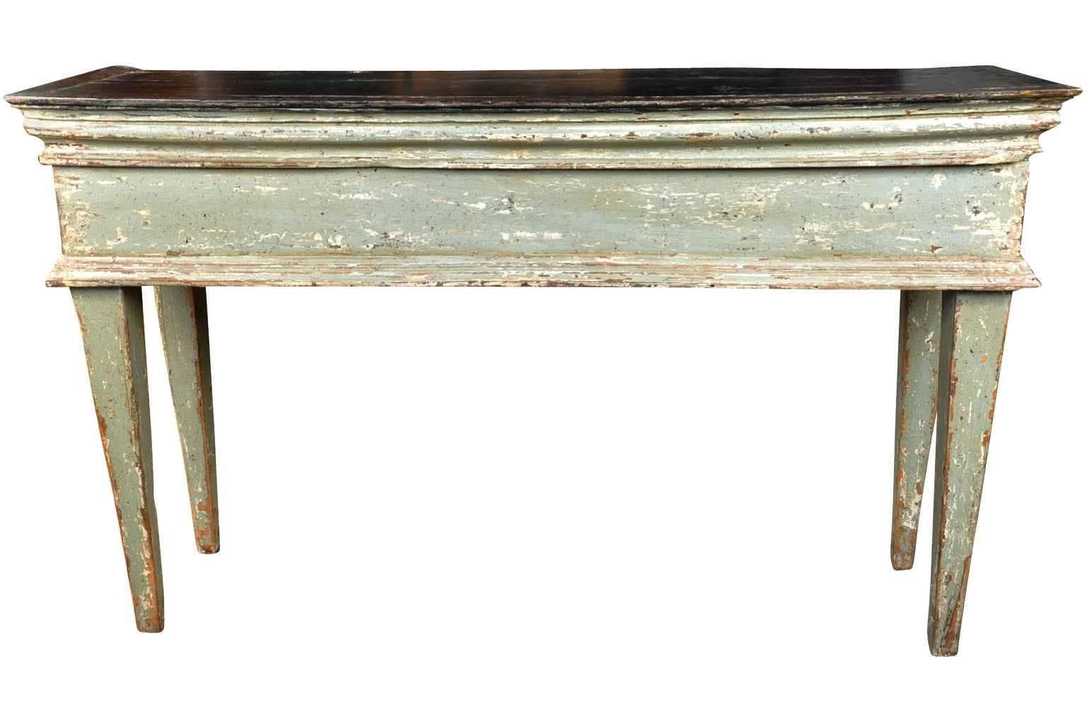 A very handsome early 19th century painted console from the Catalan region of Spain. The painted finish has a wonderful patina'd texture in wonderful hues of soft sage with an almost black top surface. An excellent piece for any living or dining
