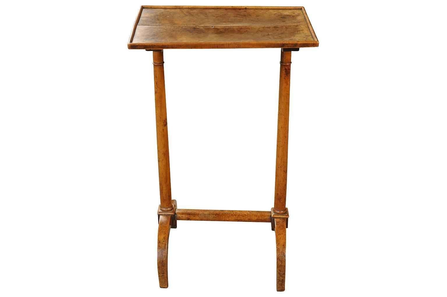 A very charming French Directoire period side table is walnut. Beautifully constructed with columnar legs ending in tapered curving feet. The graining is wonderful and the patina very rich and luminous.