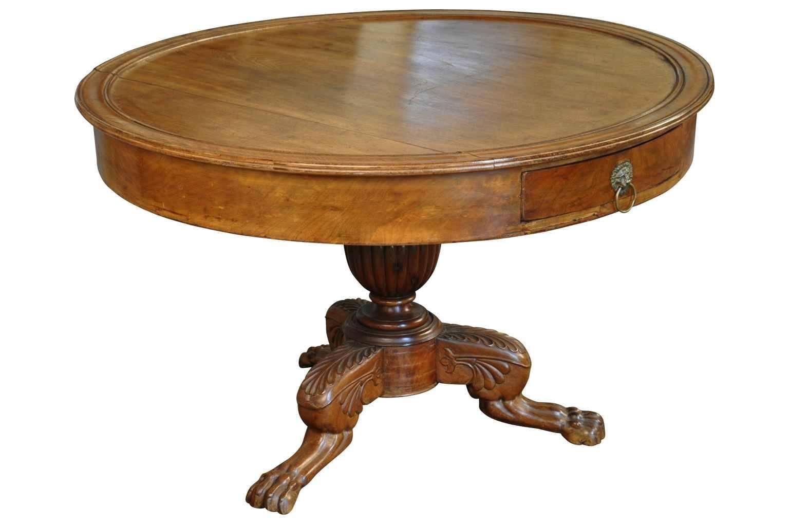 French 19th century Napoleon III style large gueridon in walnut. Handsomely constructed with a deep apron with two drawers, tripod base ending in paw feet.